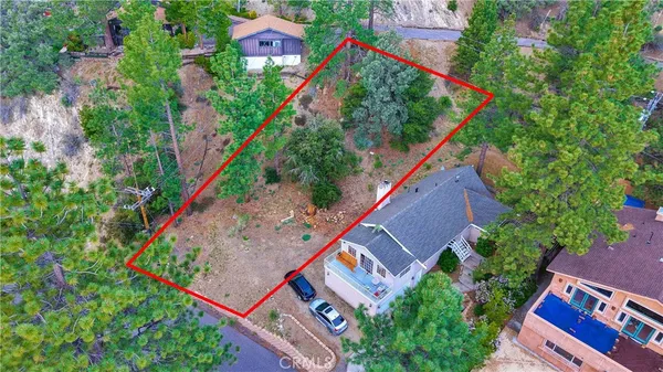 an aerial view of house with a yard