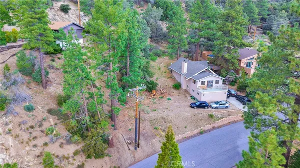 an aerial view of a house with a garden
