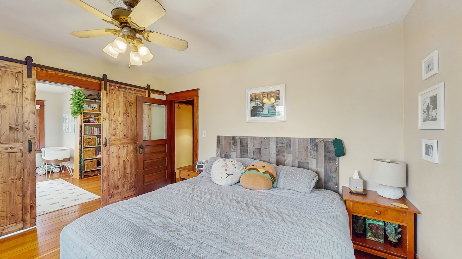 614 McCarthy Road Lemont, IL 60439 - Photo 13 of 37 a bedroom with a bed and a chandelier