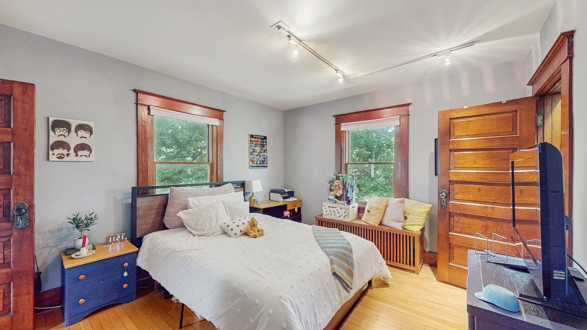 614 McCarthy Road Lemont, IL 60439 - Photo 15 of 37 a bedroom with a bed and wooden floor