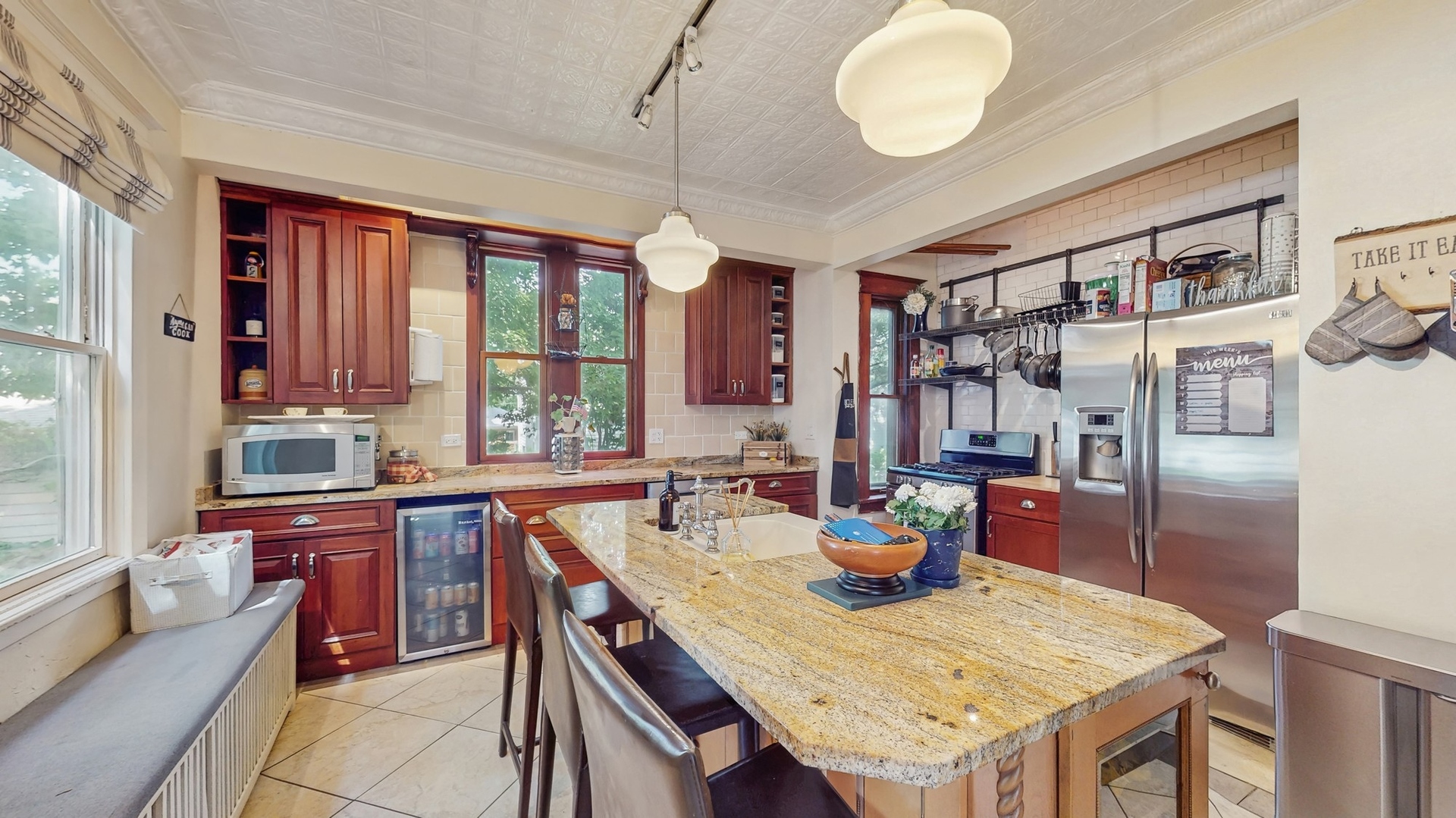 614 McCarthy Road Lemont, IL 60439 - Photo 8 of 37 a kitchen with a table chairs and refrigerator