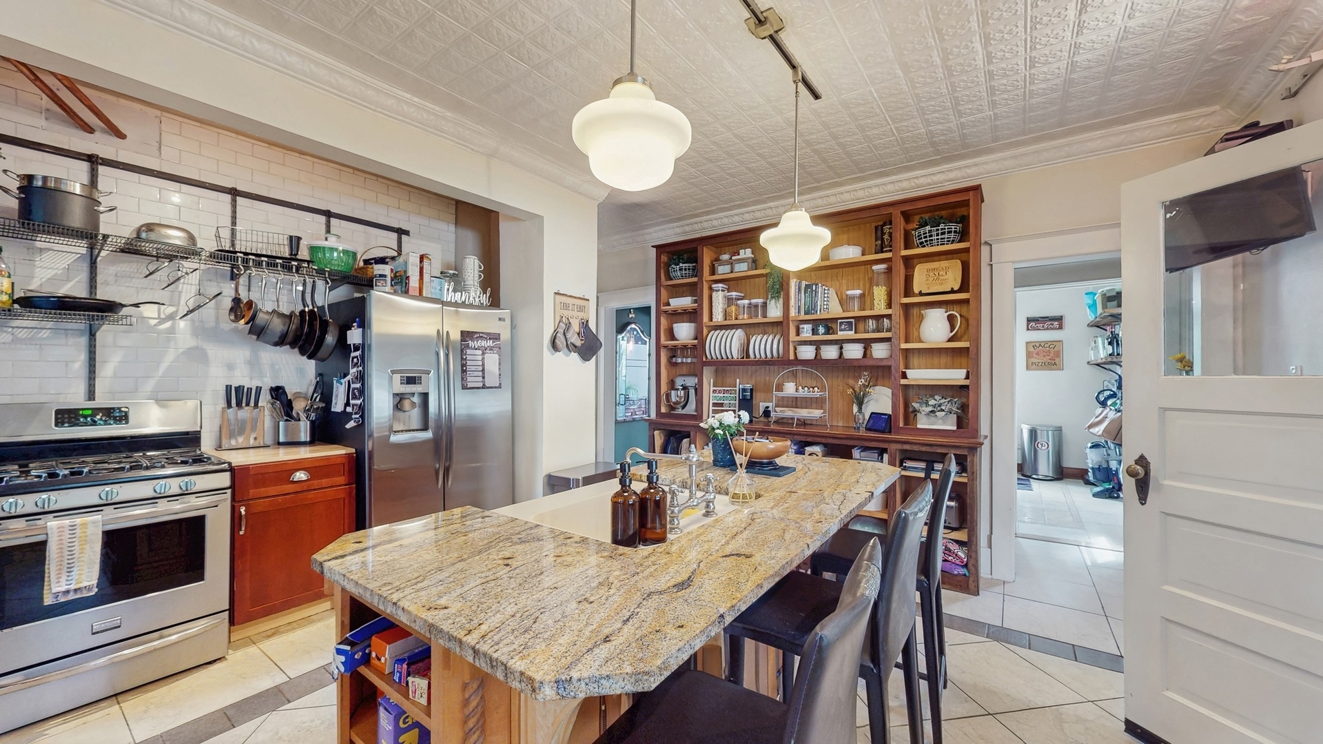 614 McCarthy Road Lemont, IL 60439 - Photo 9 of 37 a kitchen with stainless steel appliances granite countertop a stove and cabinets