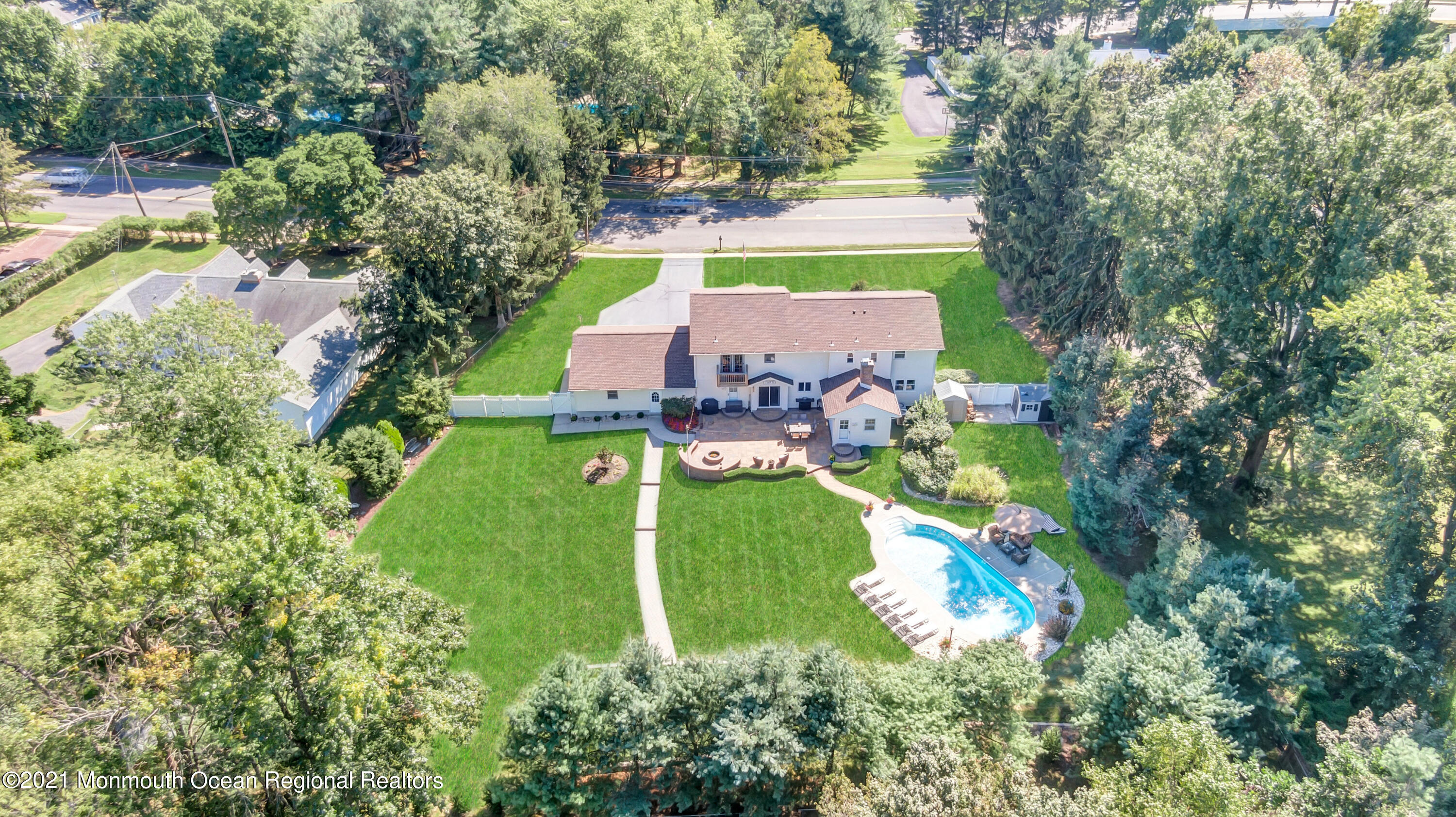 843 Nutswamp Road Red Bank, NJ 07701 - Photo 1 of 92 an aerial view of a house with a yard and lake view
