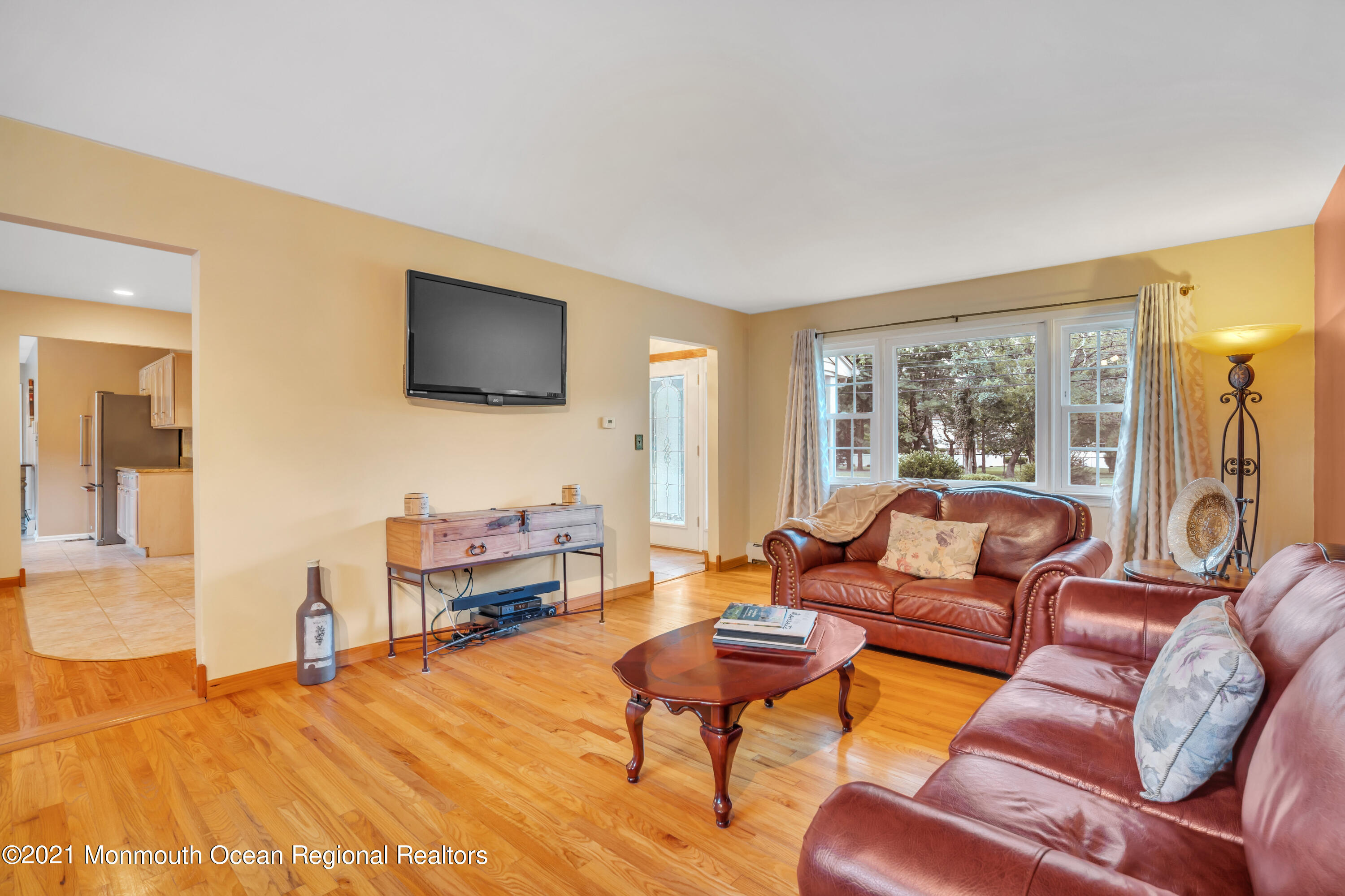 843 Nutswamp Road Red Bank, NJ 07701 - Photo 13 of 92 a living room with furniture and a flat screen tv