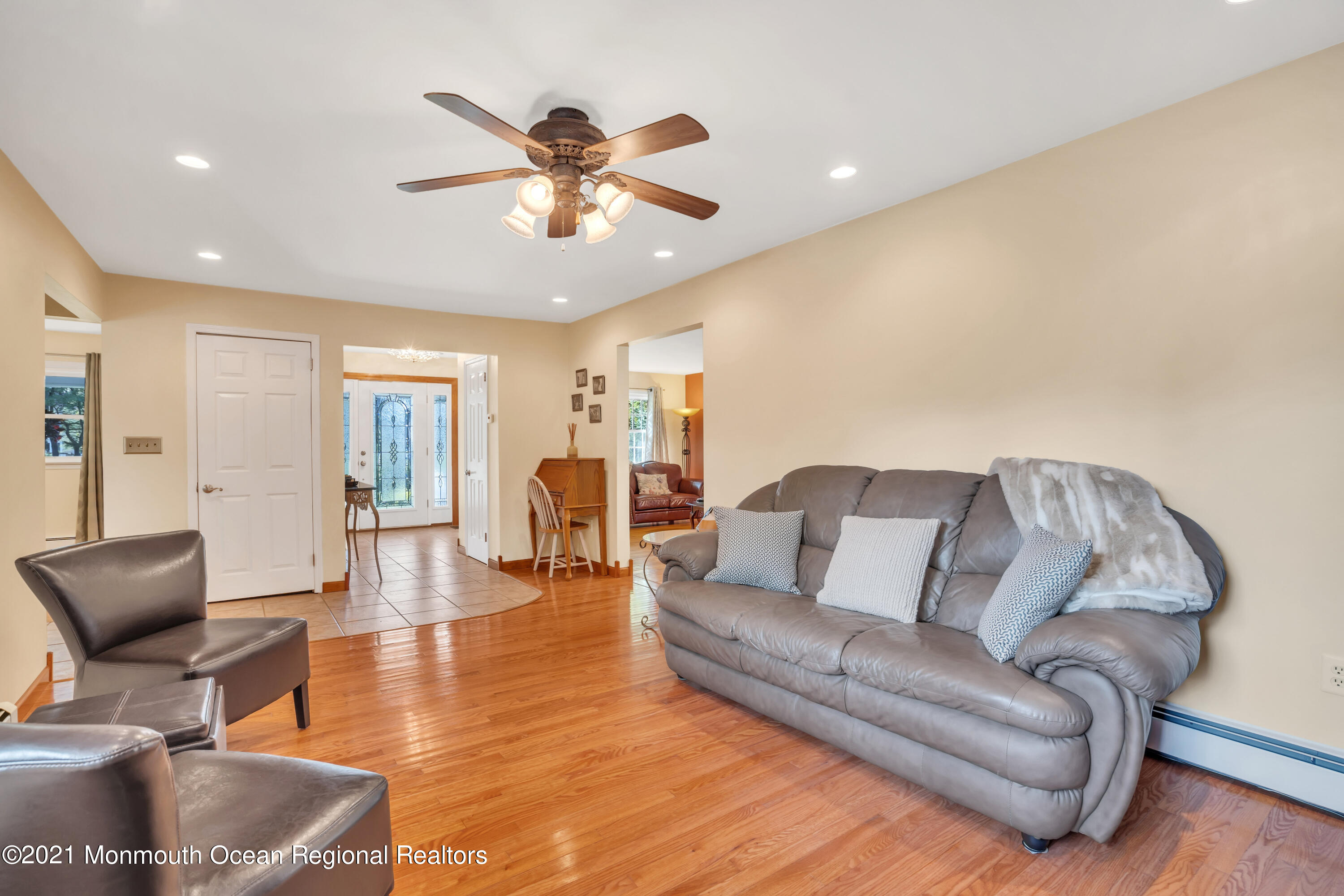 843 Nutswamp Road Red Bank, NJ 07701 - Photo 15 of 92 a living room with furniture and a large mirror
