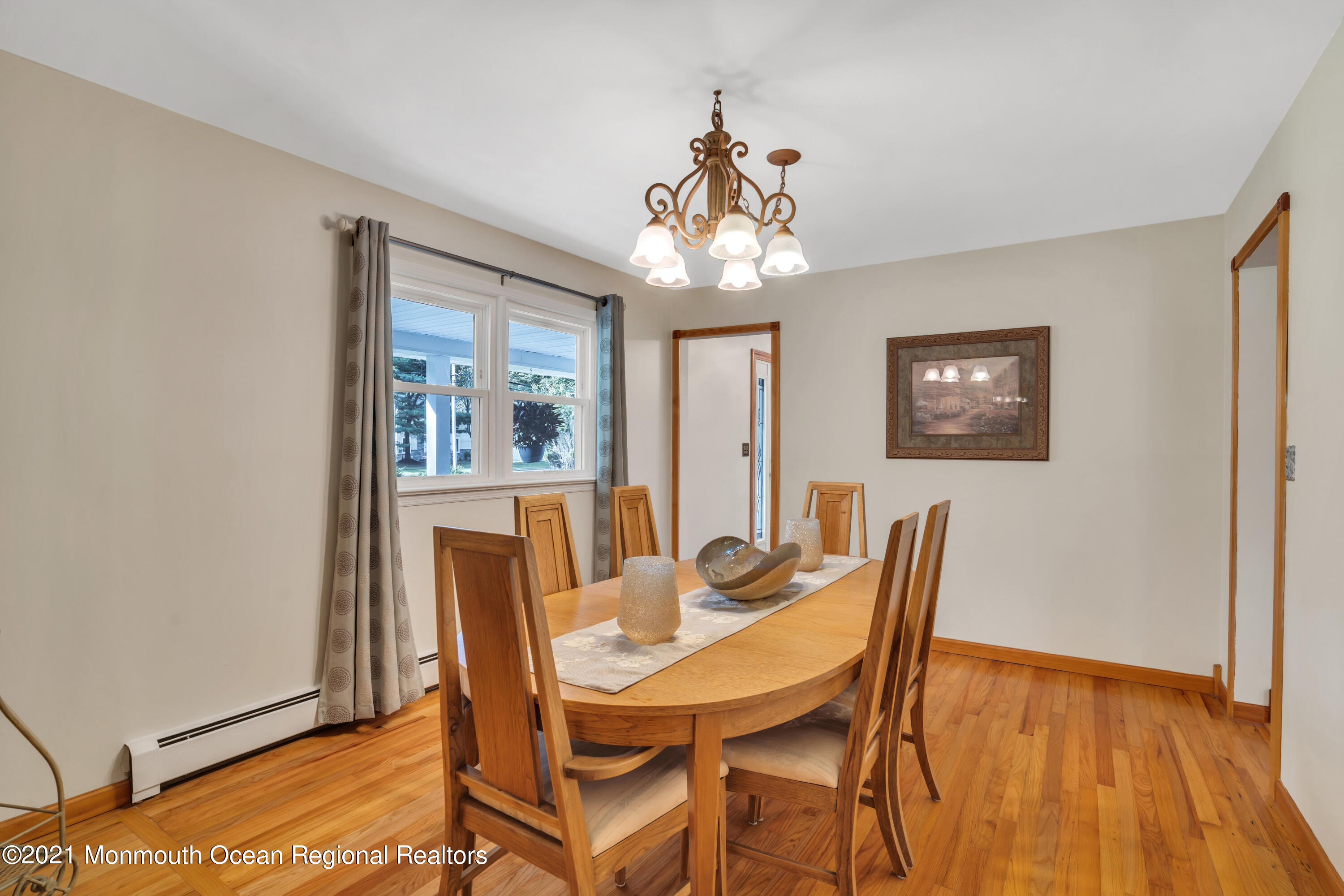 843 Nutswamp Road Red Bank, NJ 07701 - Photo 21 of 92 a view of a dining room with furniture wooden floor and chandelier