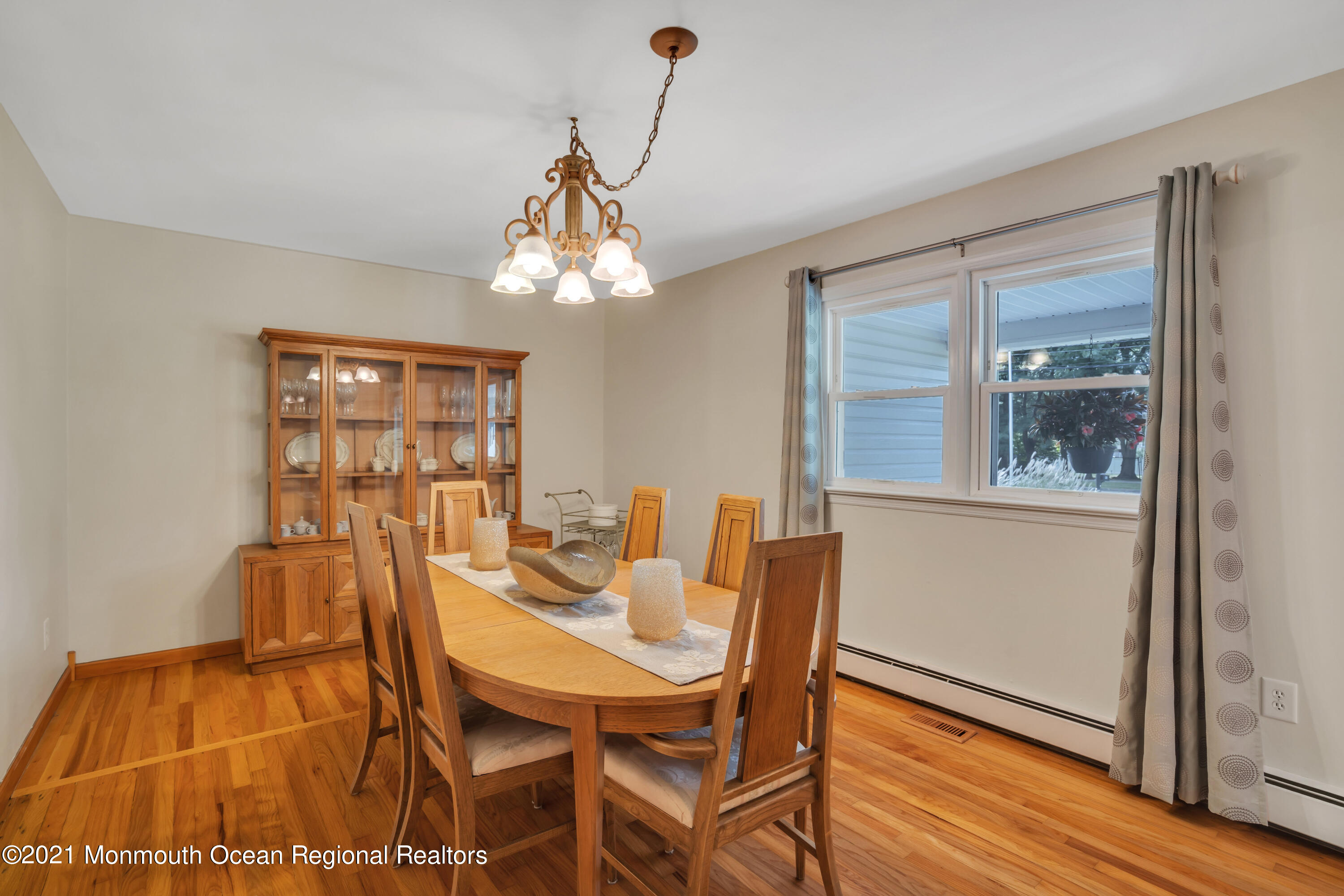843 Nutswamp Road Red Bank, NJ 07701 - Photo 22 of 92 a view of a dining room with furniture and wooden floor