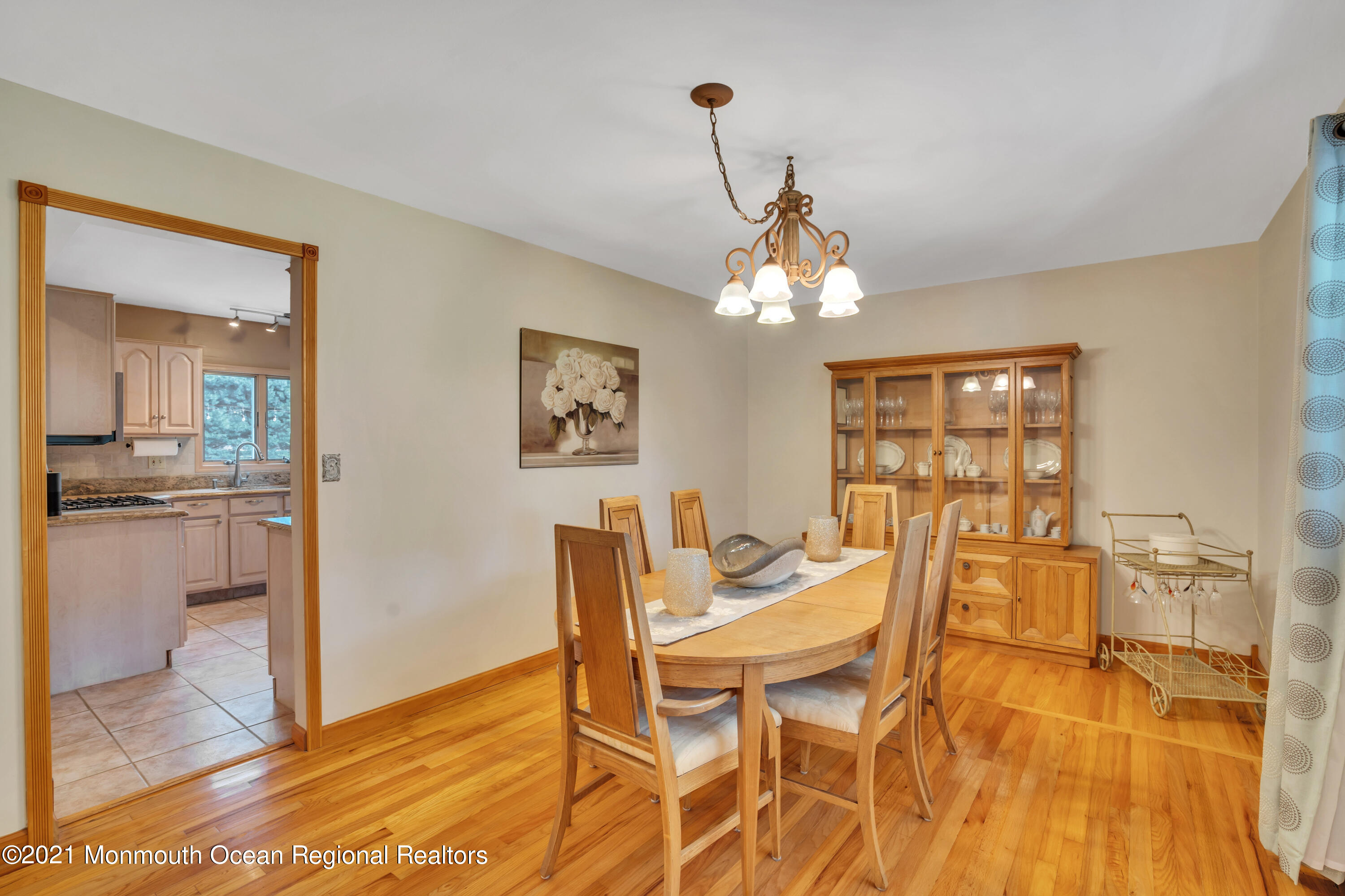 843 Nutswamp Road Red Bank, NJ 07701 - Photo 23 of 92 a view of a dining room with furniture and wooden floor