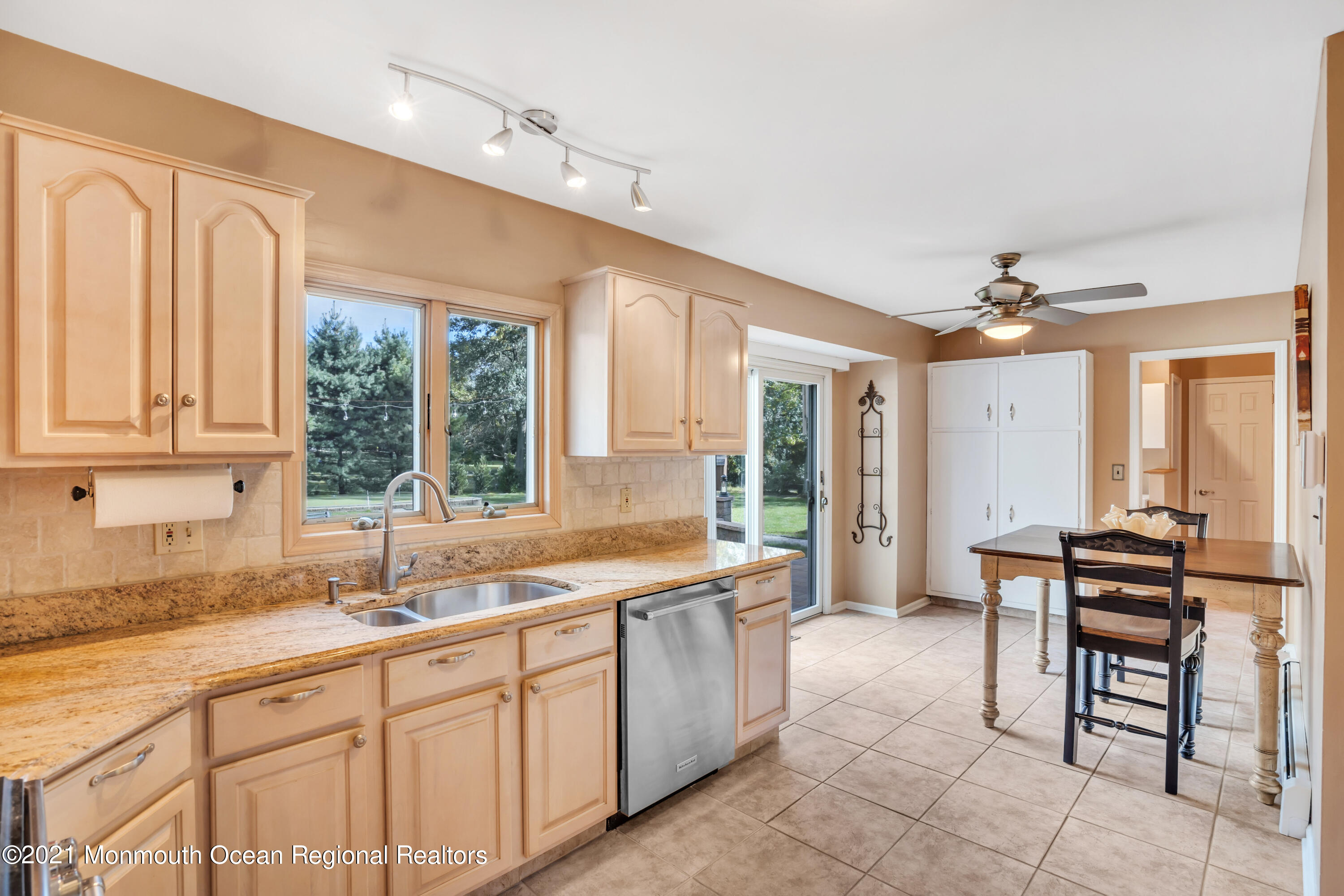 843 Nutswamp Road Red Bank, NJ 07701 - Photo 24 of 92 a large white kitchen with a large window