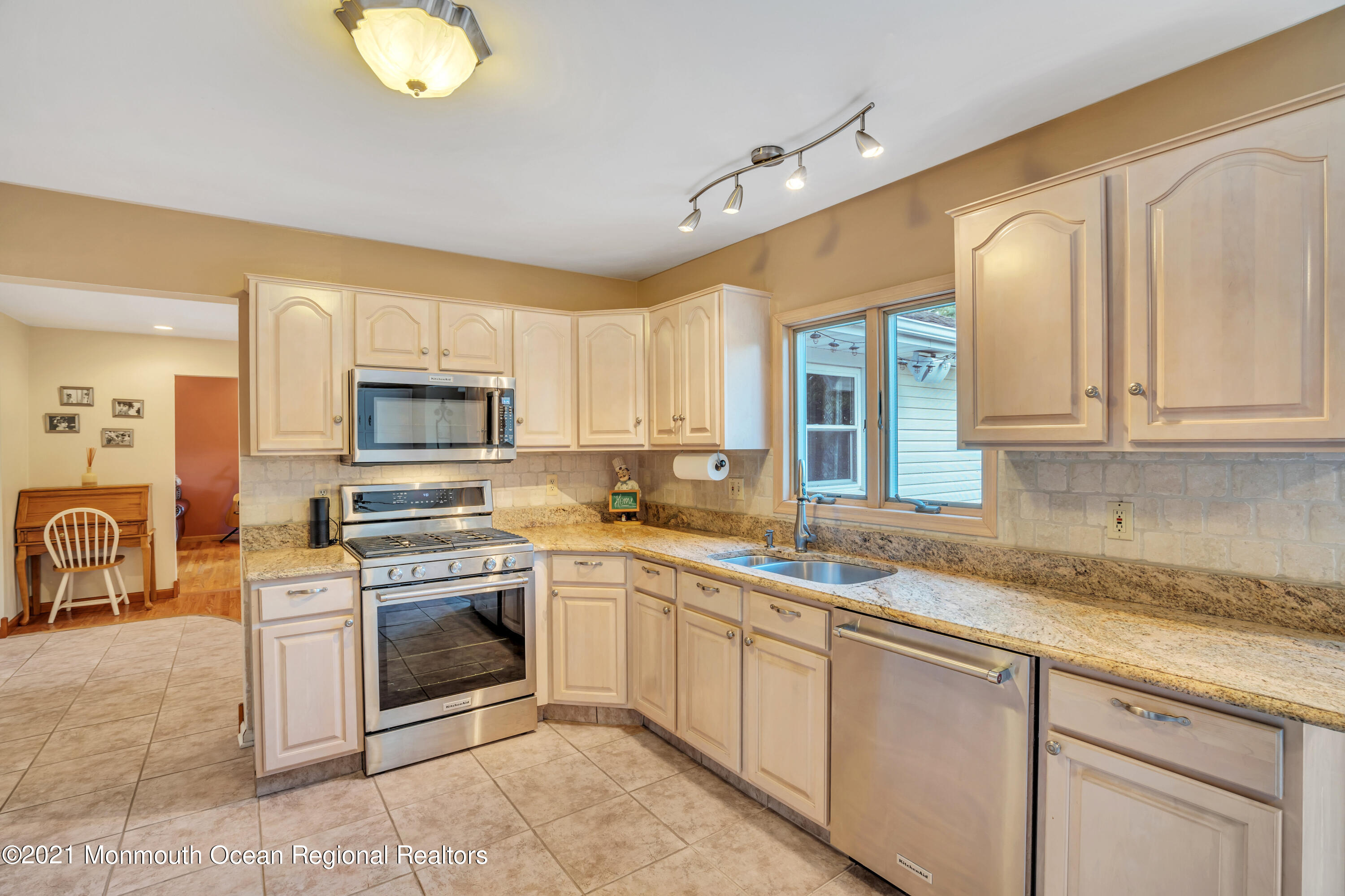 843 Nutswamp Road Red Bank, NJ 07701 - Photo 28 of 92 a kitchen with stainless steel appliances granite countertop a sink and cabinets