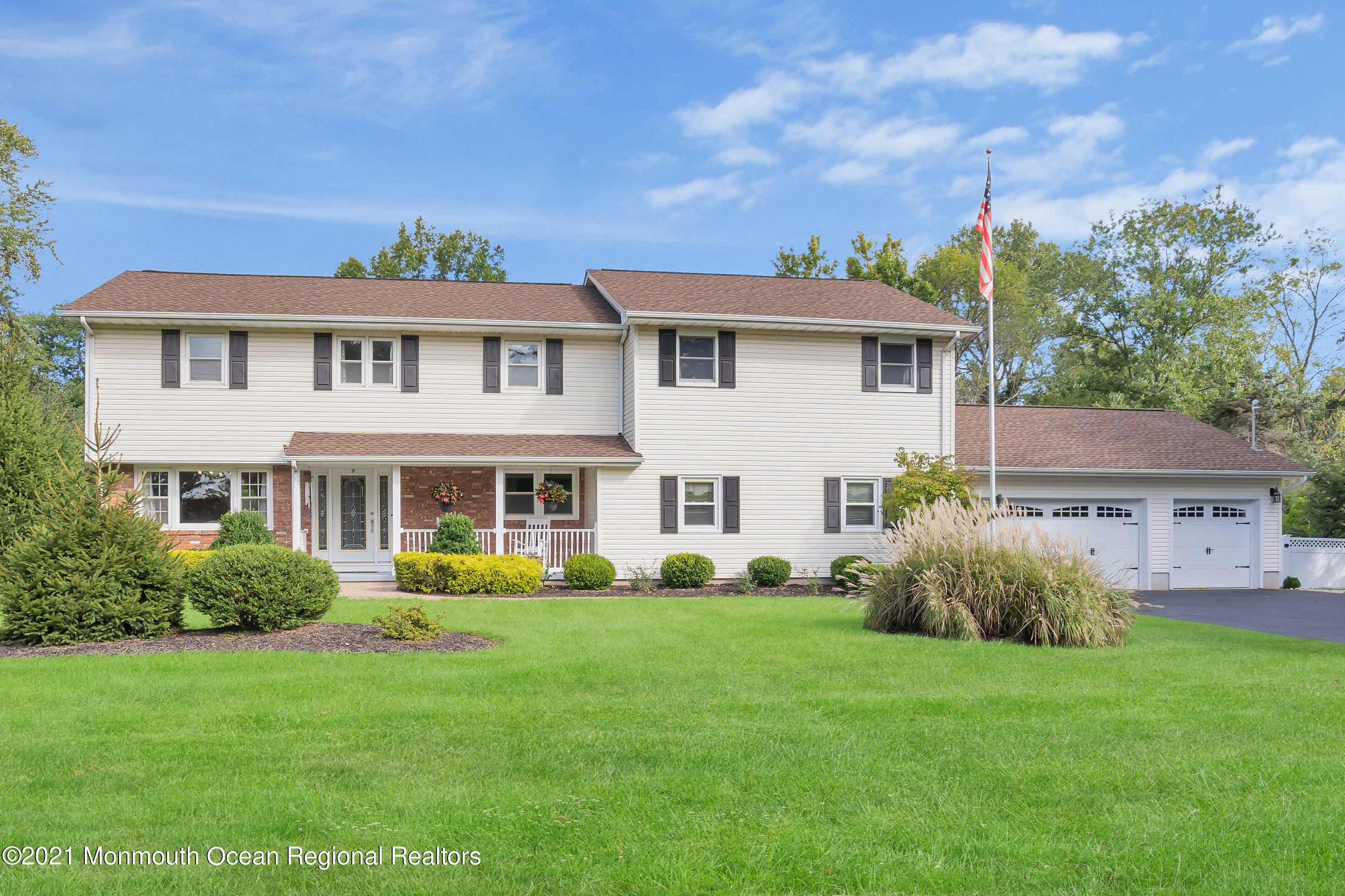 843 Nutswamp Road Red Bank, NJ 07701 - Photo 4 of 92 a front view of a house with garden