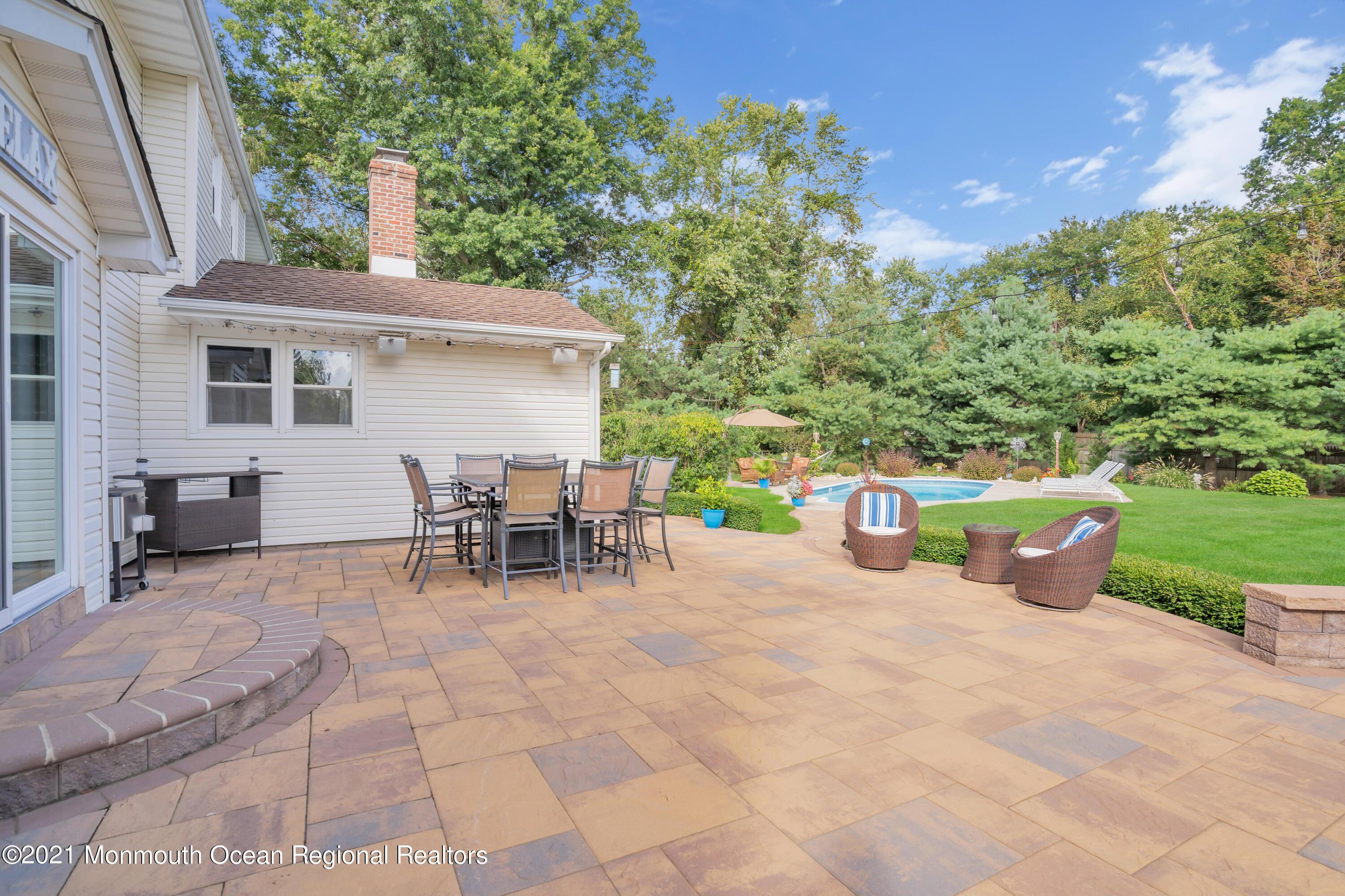 843 Nutswamp Road Red Bank, NJ 07701 - Photo 32 of 92 a view of a chairs and table in backyard of the house