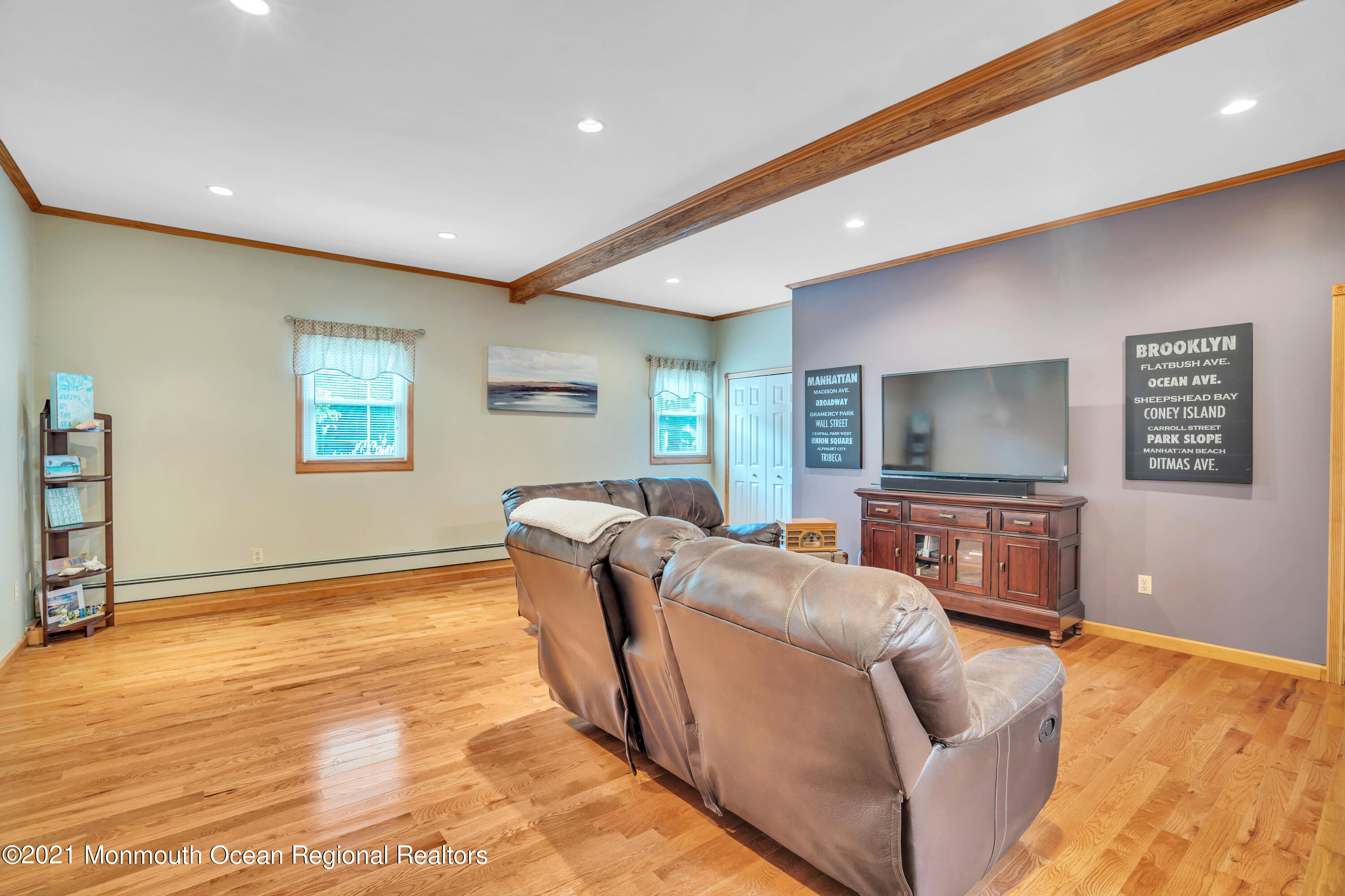 843 Nutswamp Road Red Bank, NJ 07701 - Photo 34 of 92 a living room with furniture and a flat screen tv