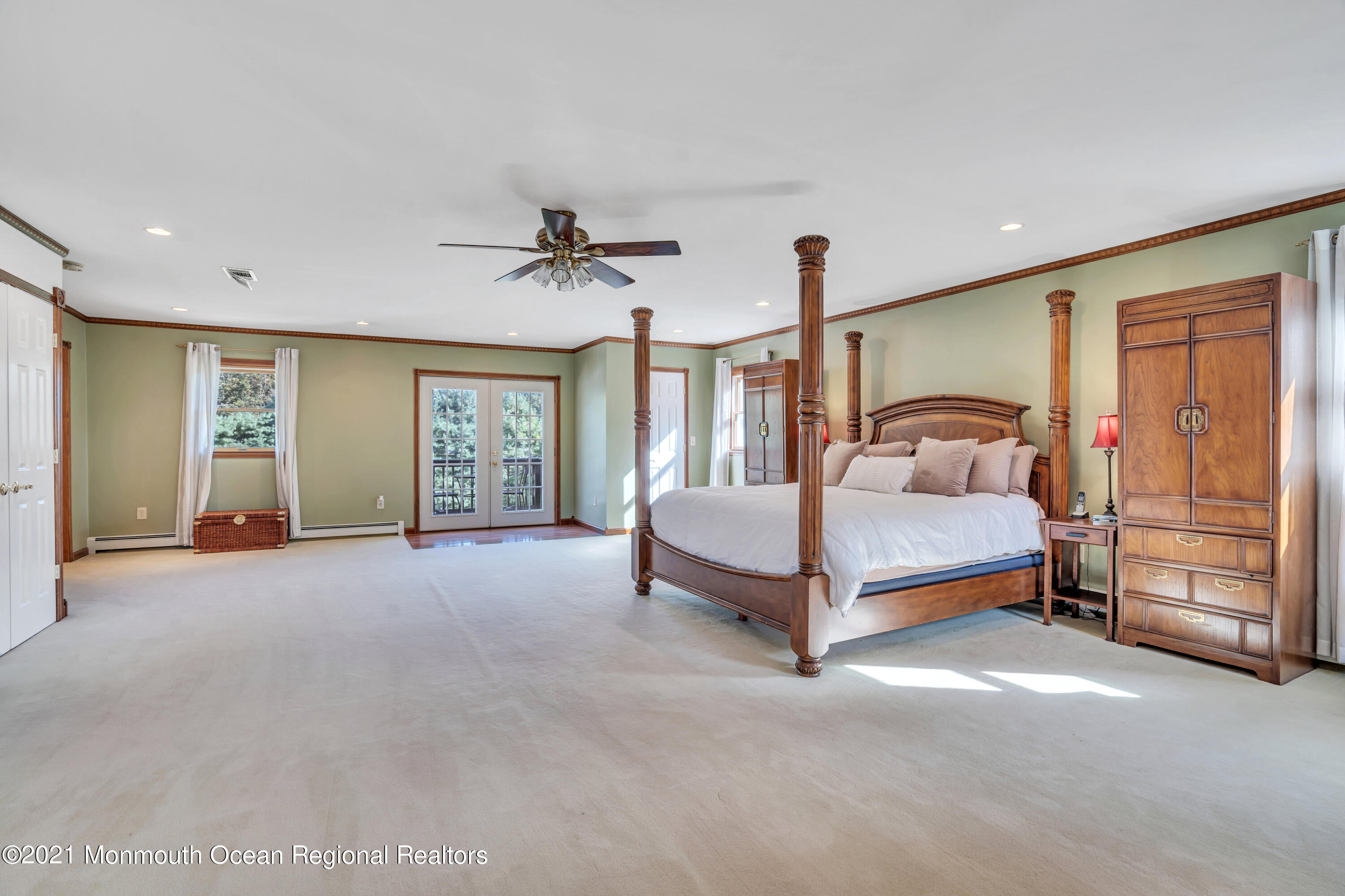 843 Nutswamp Road Red Bank, NJ 07701 - Photo 45 of 92 a spacious bedroom with a bed and a cabinets
