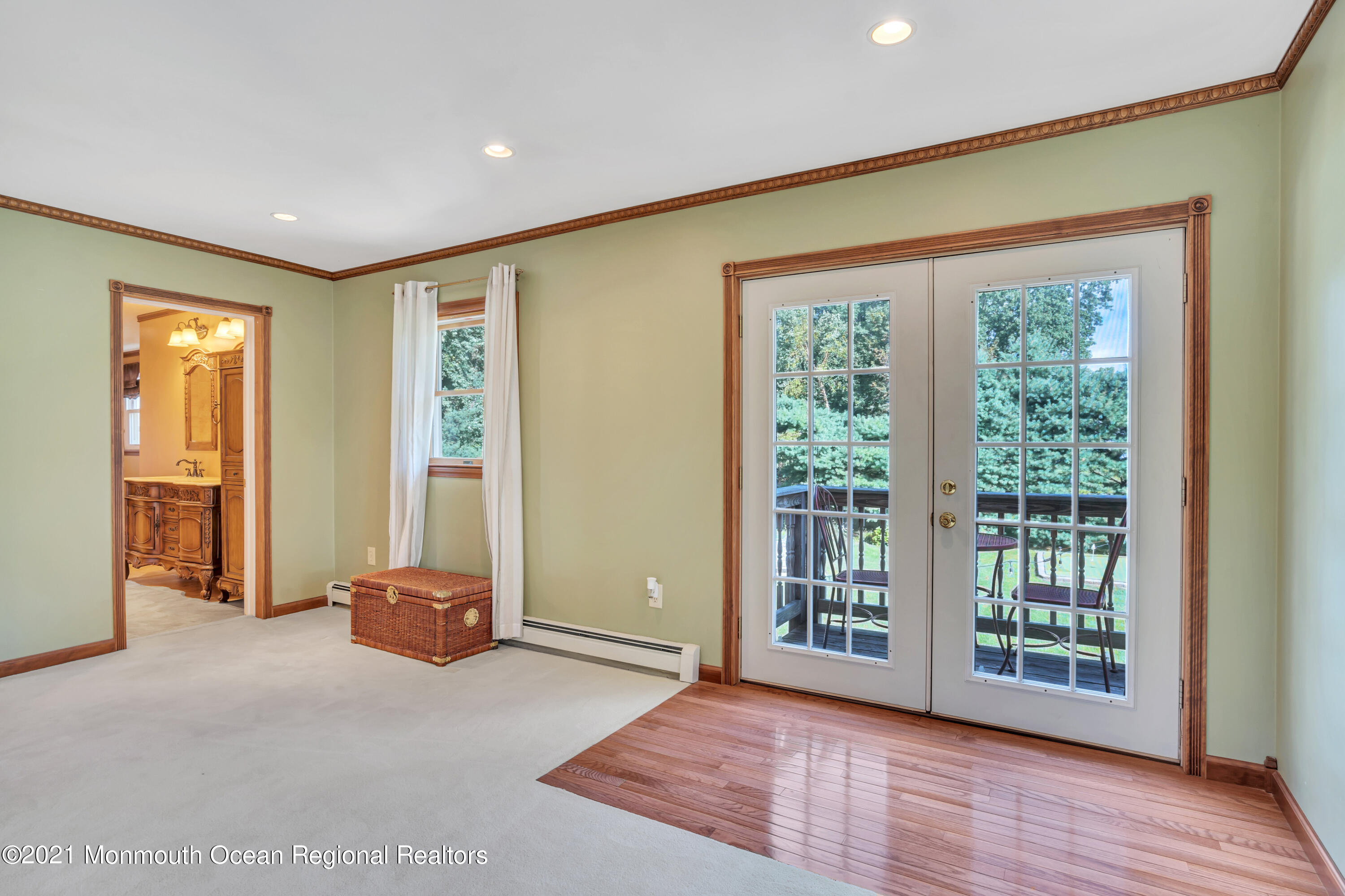 843 Nutswamp Road Red Bank, NJ 07701 - Photo 46 of 92 a view of an empty room with wooden floor and a window