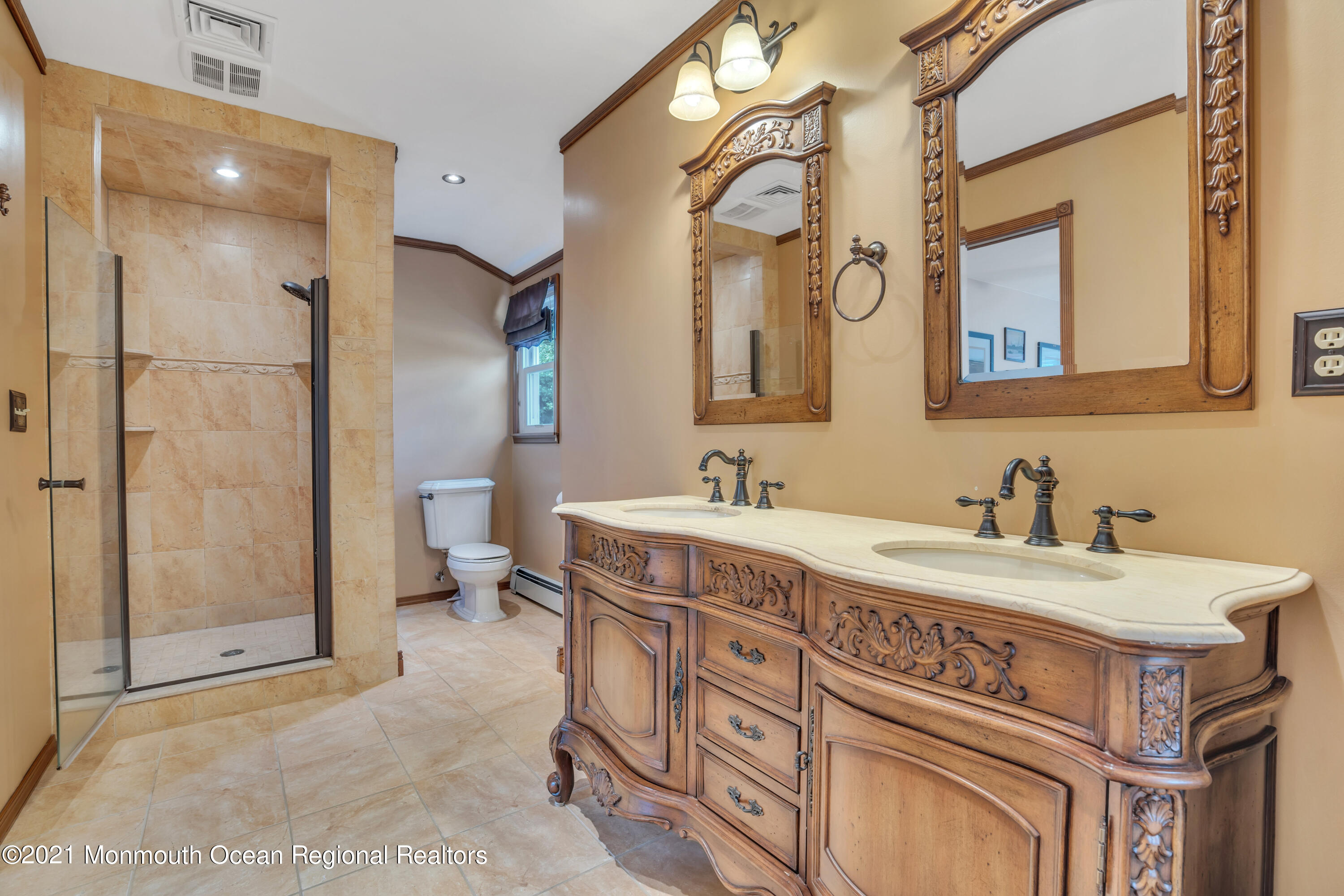 843 Nutswamp Road Red Bank, NJ 07701 - Photo 47 of 92 a spacious bathroom with a sink double vanity and a mirror