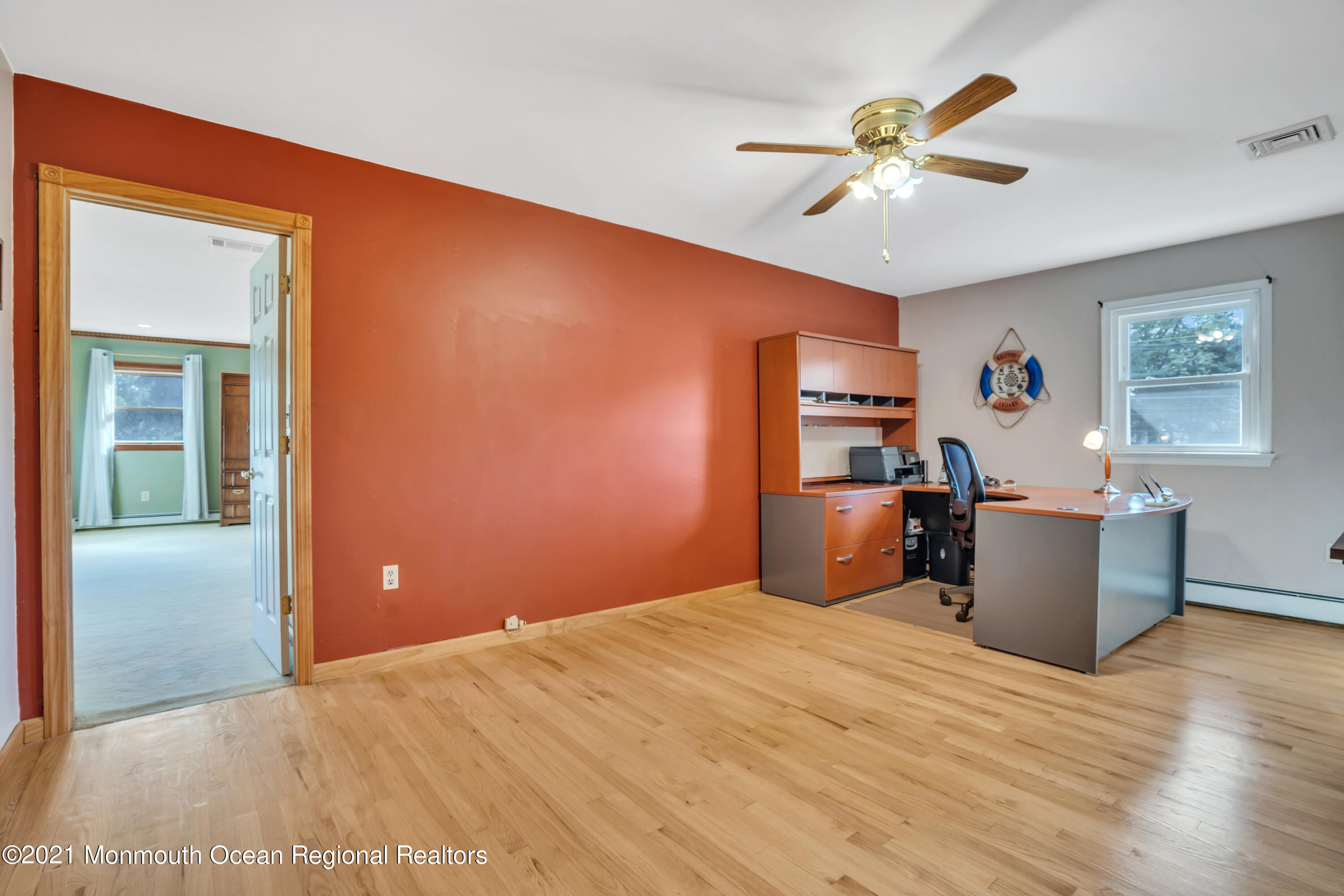 843 Nutswamp Road Red Bank, NJ 07701 - Photo 49 of 92 a bedroom with a bed and a chandelier
