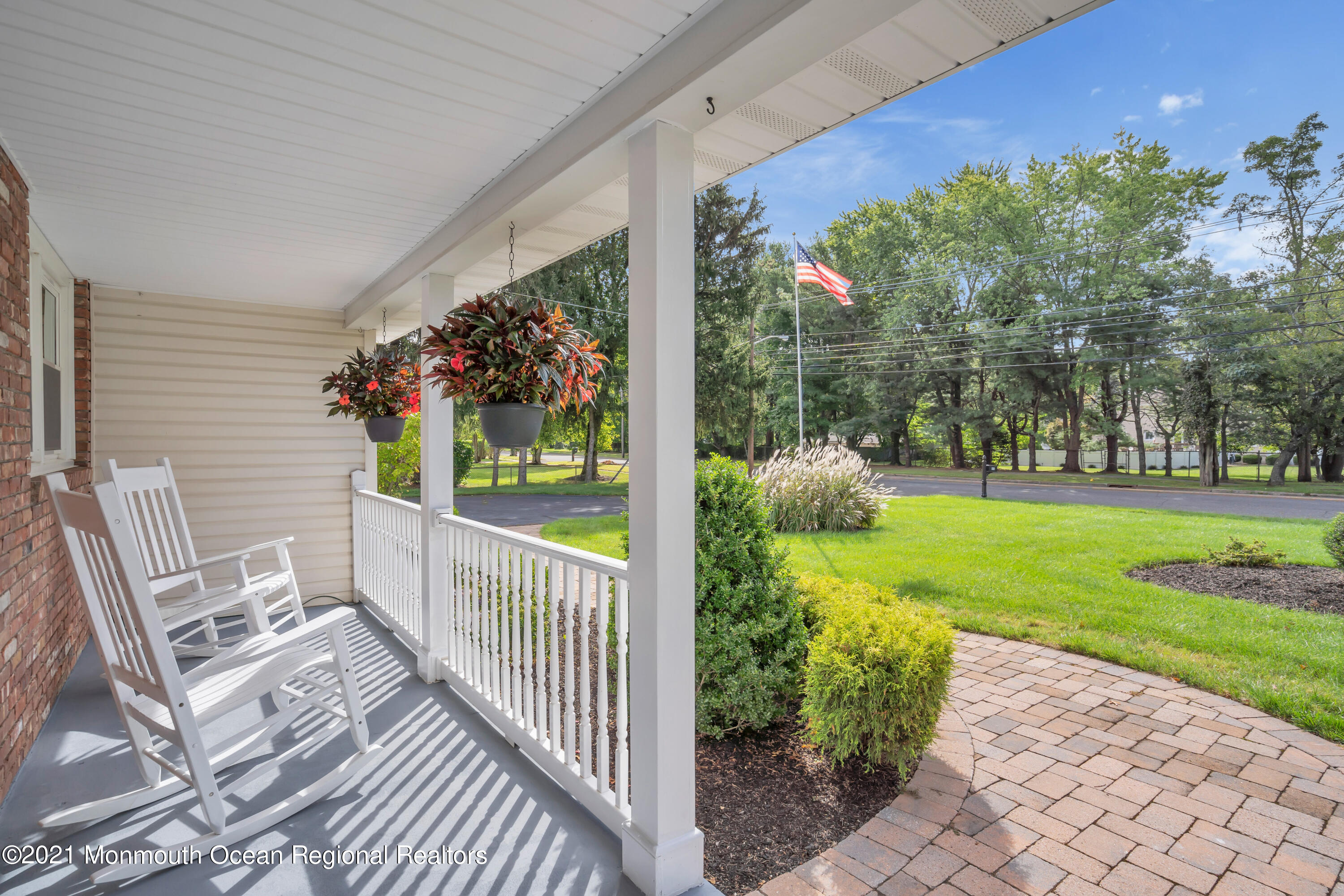843 Nutswamp Road Red Bank, NJ 07701 - Photo 6 of 92 a view of a porch with furniture and garden
