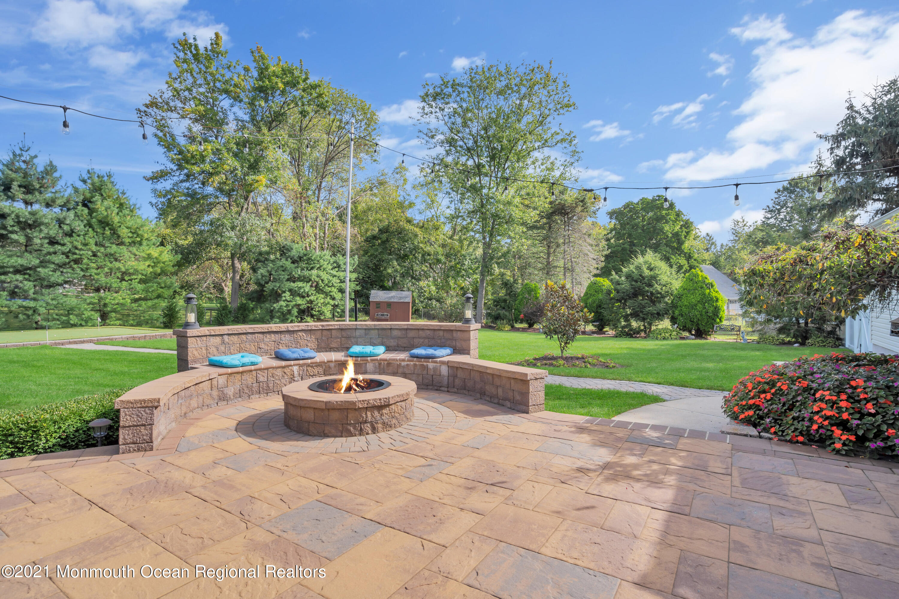 843 Nutswamp Road Red Bank, NJ 07701 - Photo 60 of 92 a backyard of a house with a yard and outdoor seating