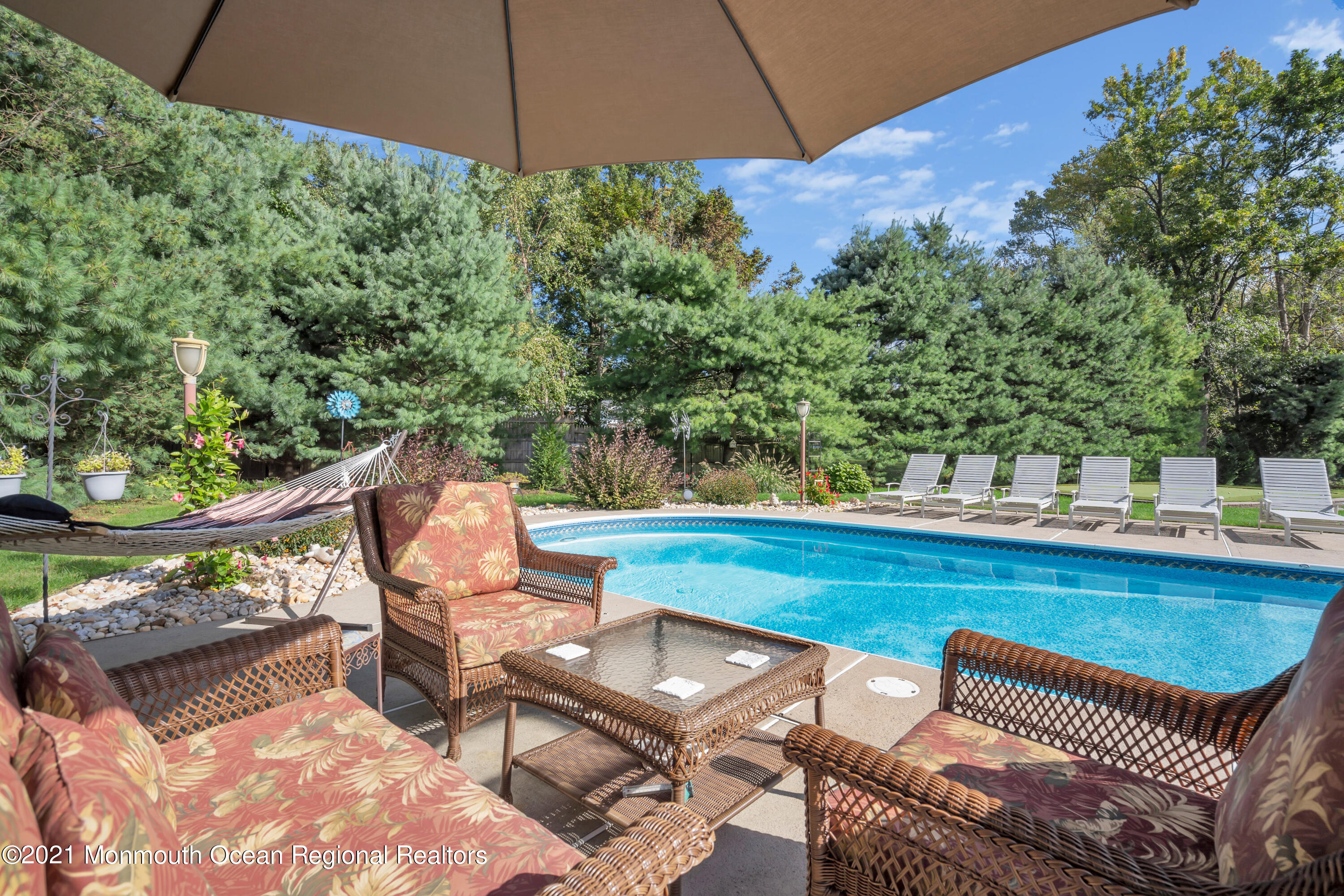 843 Nutswamp Road Red Bank, NJ 07701 - Photo 64 of 92 a view of a chairs and table in the patio
