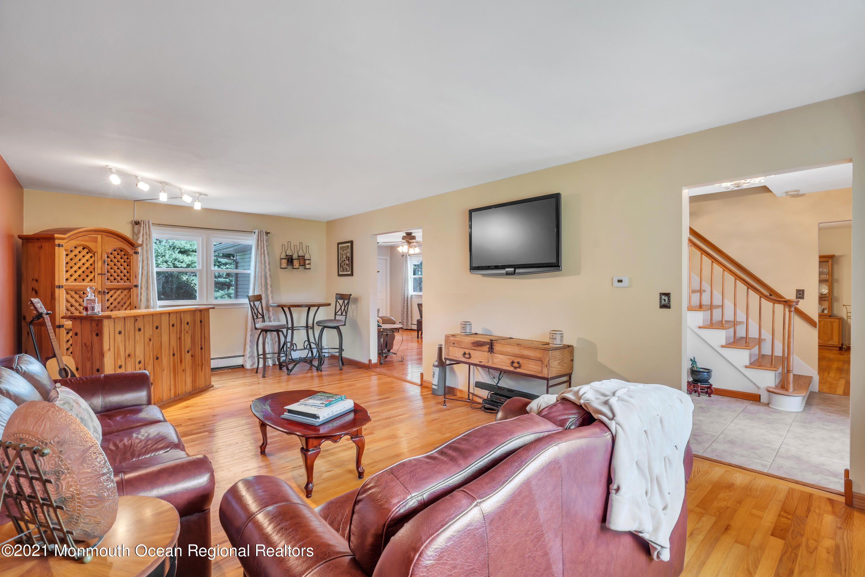 843 Nutswamp Road Red Bank, NJ 07701 - Photo 10 of 92 a living room with furniture and a flat screen tv