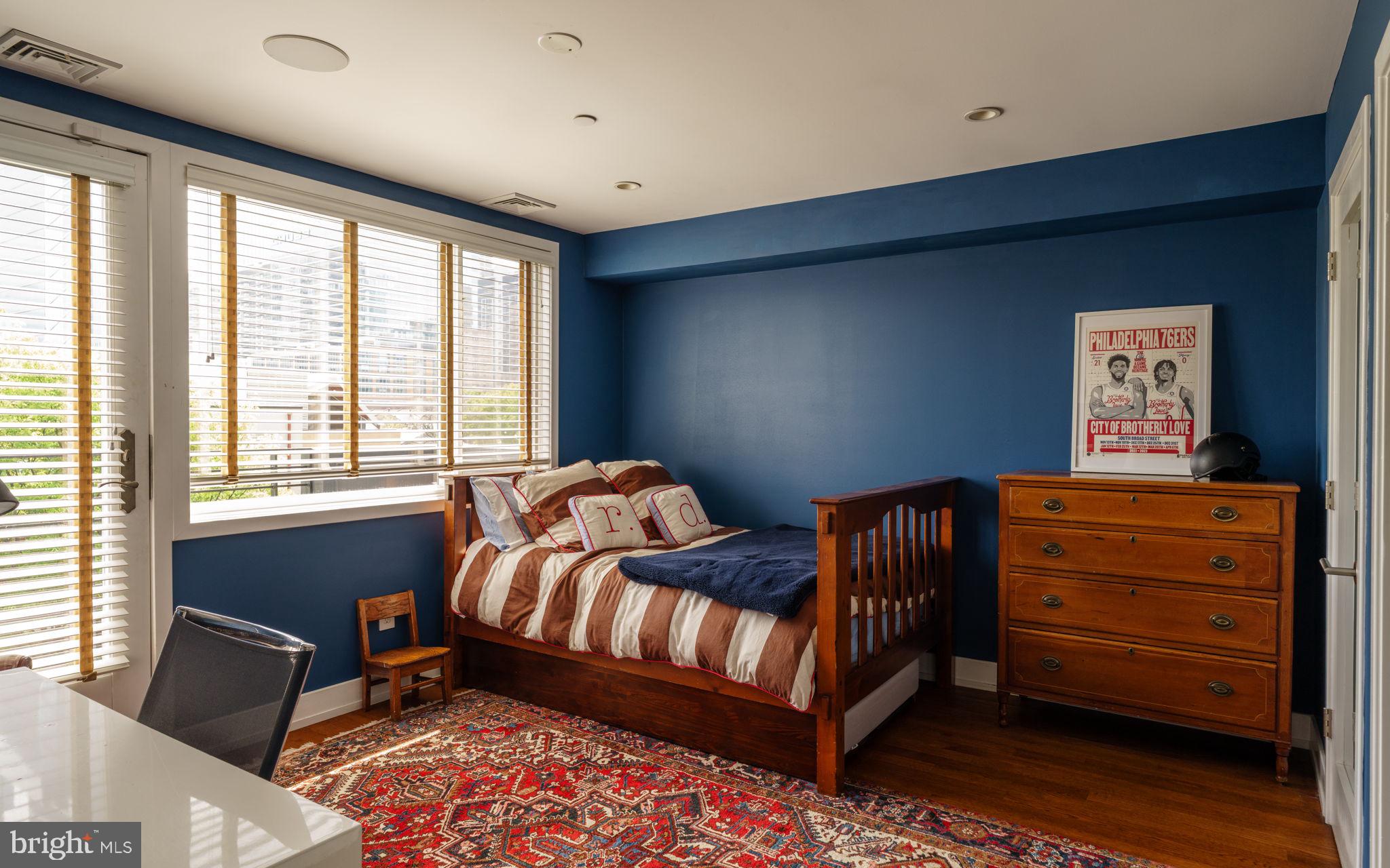 136 North 22nd Street Philadelphia, PA 19103 - Photo 16 of 29 a bedroom with a bed and a dresser