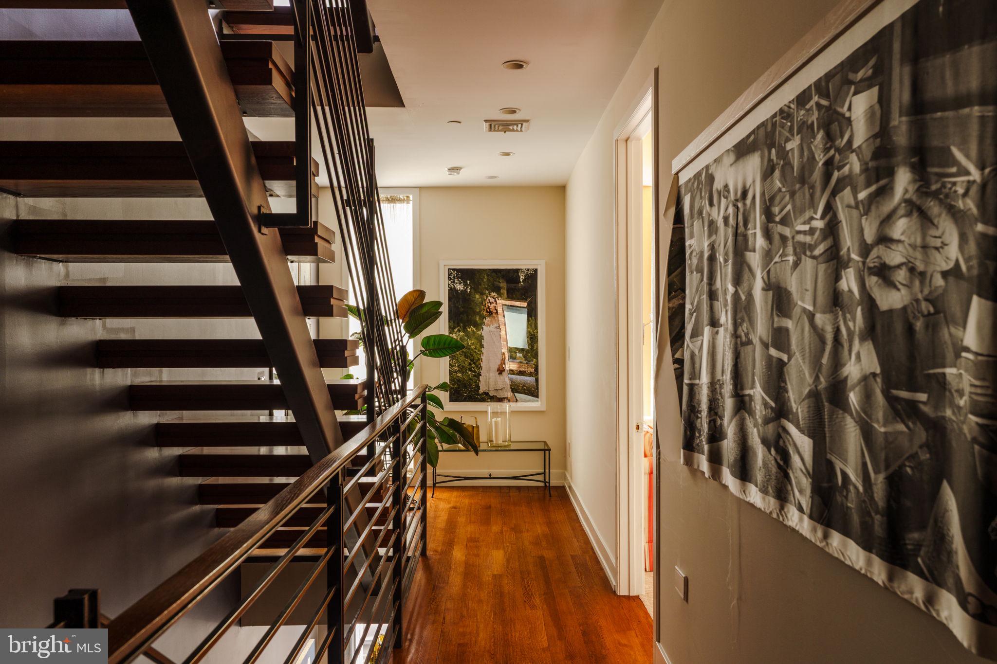 136 North 22nd Street Philadelphia, PA 19103 - Photo 8 of 29 a view of an entryway with wooden floor and stairs