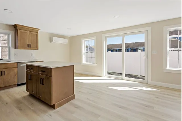 a kitchen with stainless steel appliances a refrigerator and a stove top oven
