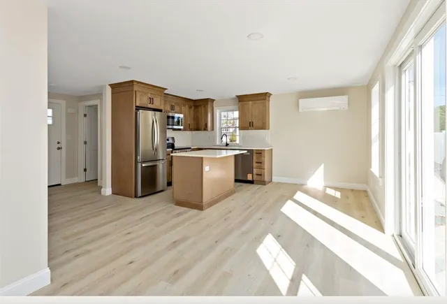 a kitchen with stainless steel appliances a refrigerator and a sink