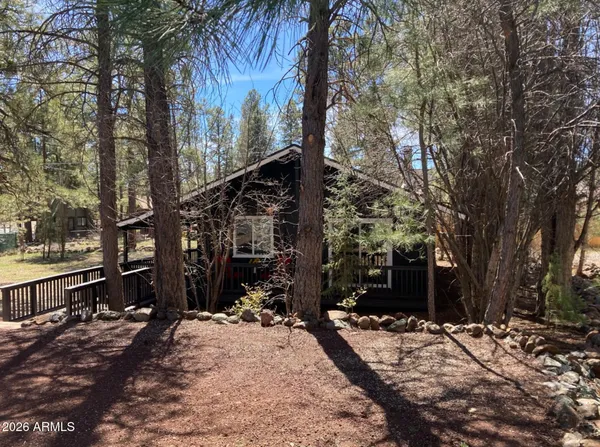 a view of a street with trees on both side of it