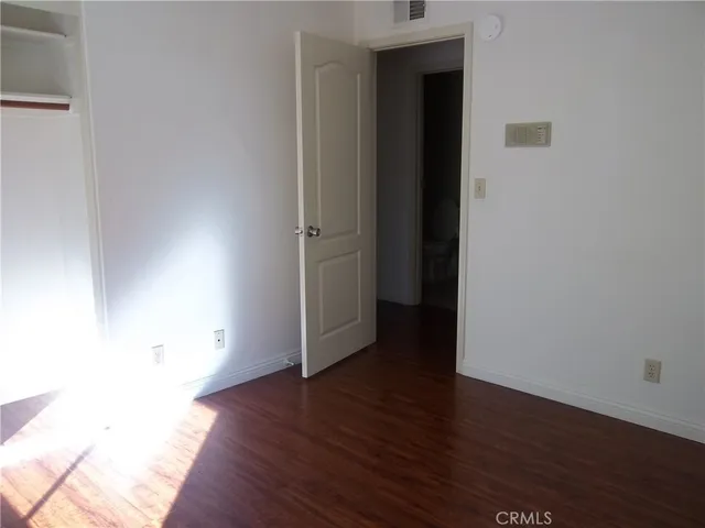 a view of a livingroom with wooden floor