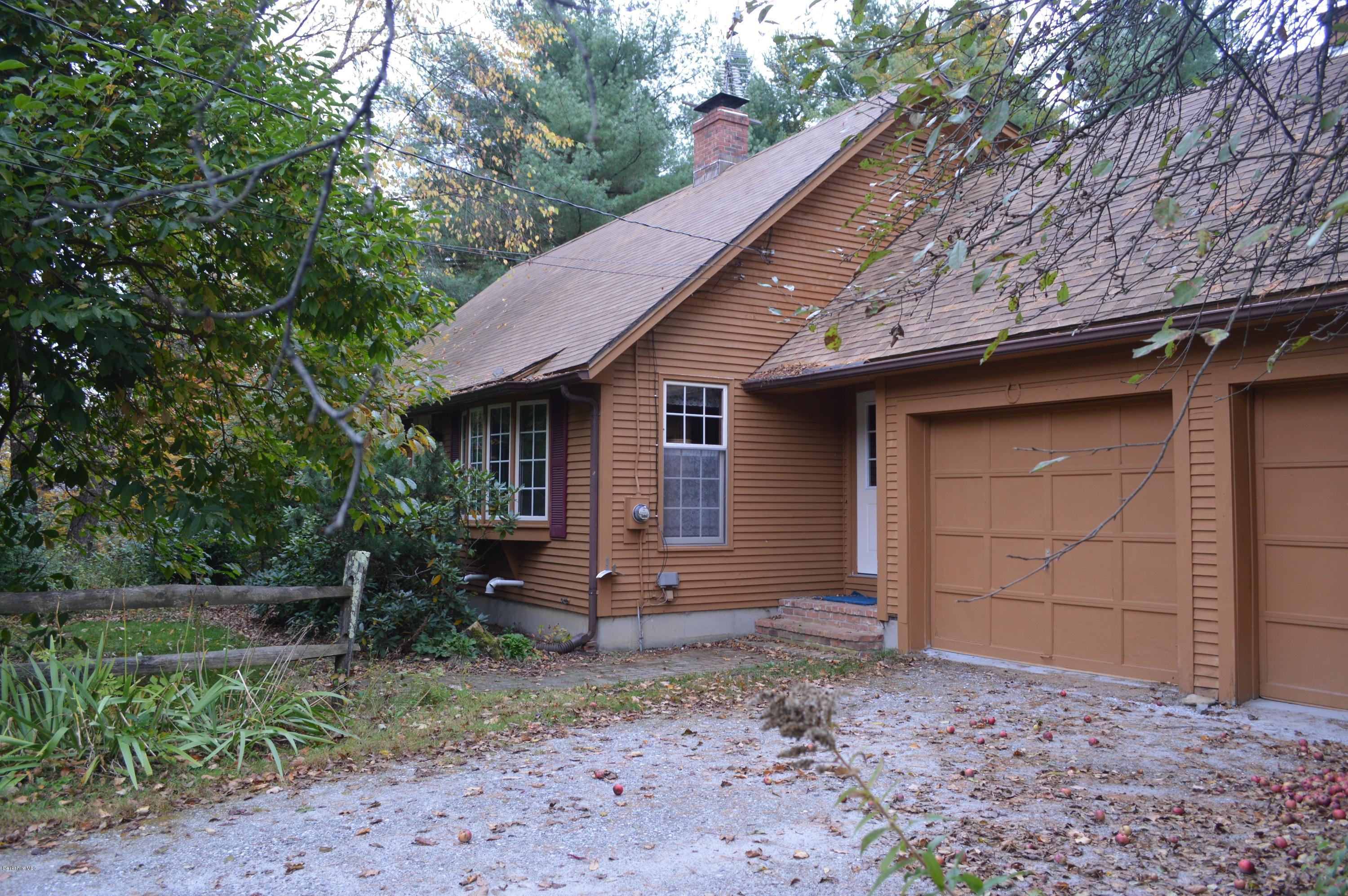67 Main Road Tyringham, MA 01238 - Photo 1 of 20 a backyard of a house