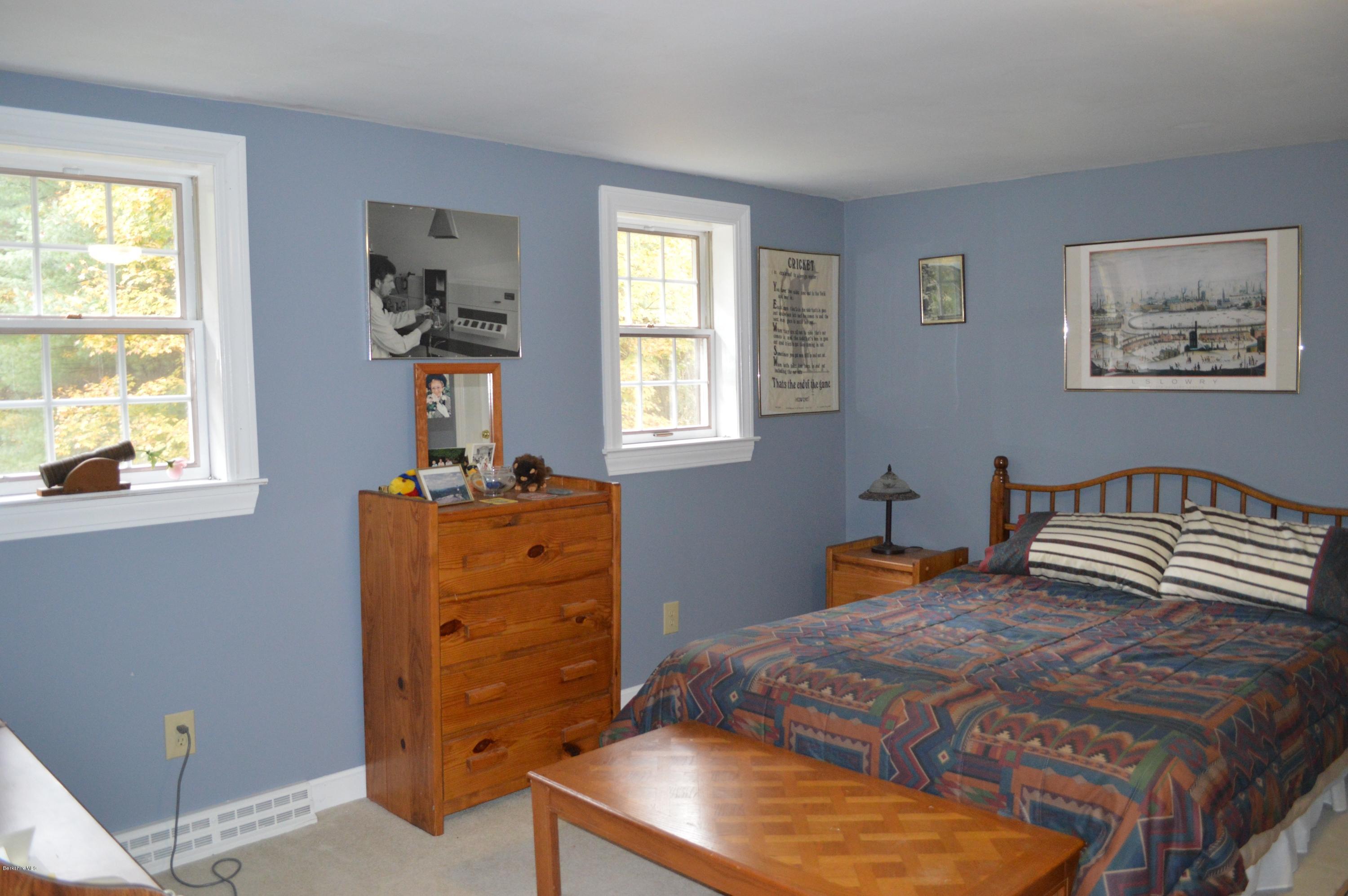 67 Main Road Tyringham, MA 01238 - Photo 12 of 20 a bedroom with a bed and a dresser in it
