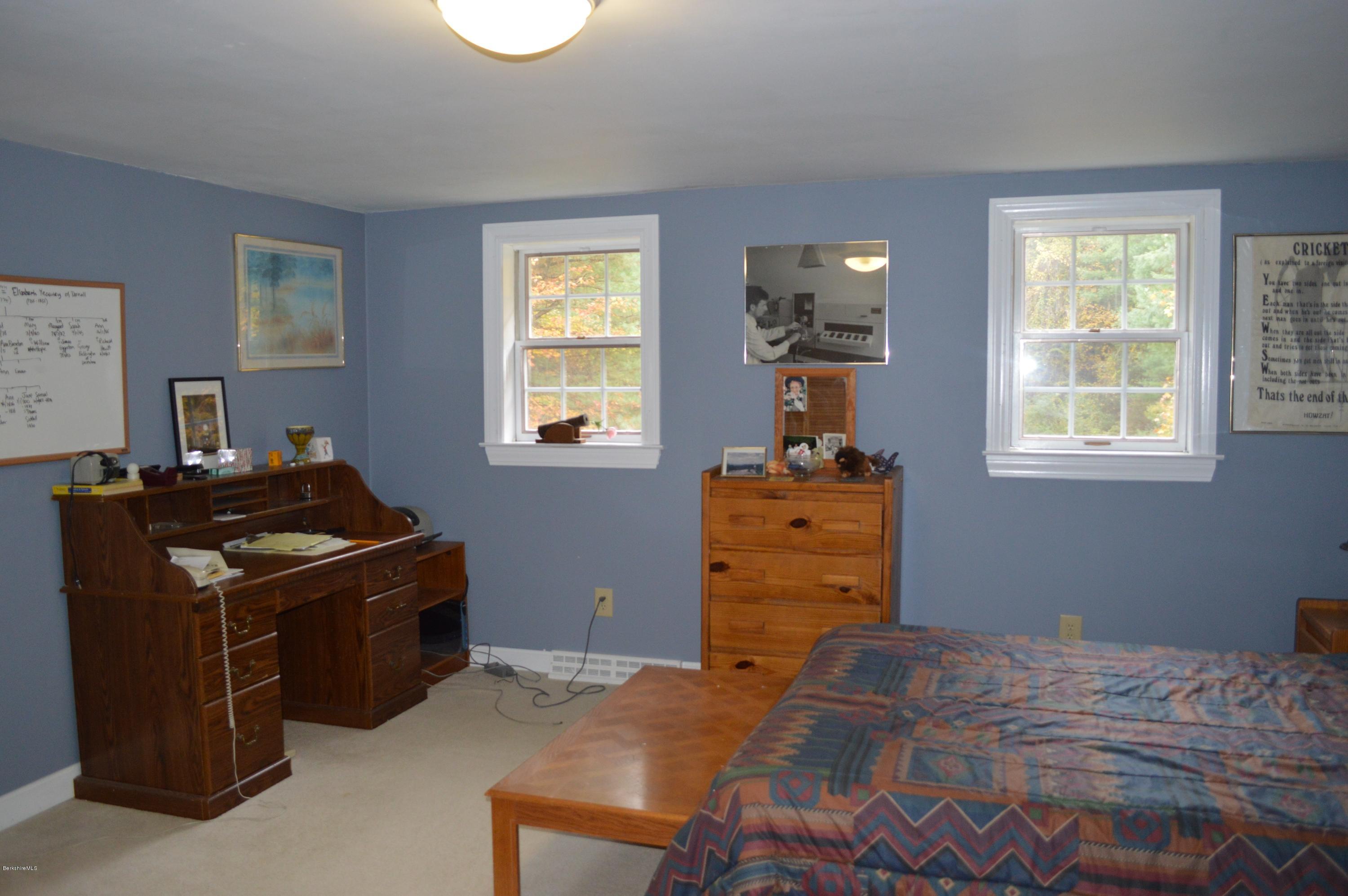 67 Main Road Tyringham, MA 01238 - Photo 13 of 20 a bed room with a bed and a window