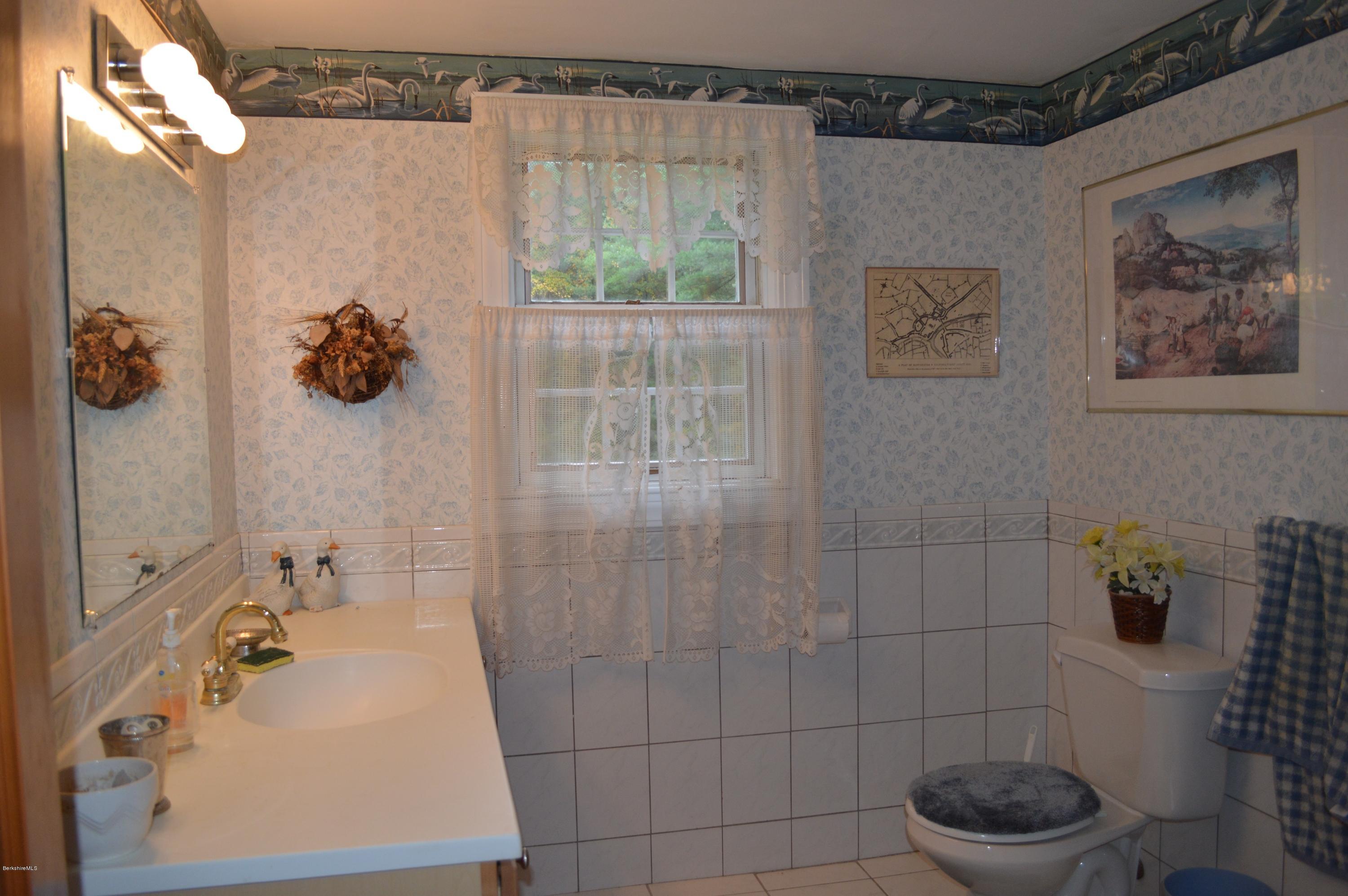 67 Main Road Tyringham, MA 01238 - Photo 16 of 20 a bathroom with a sink toilet and shower