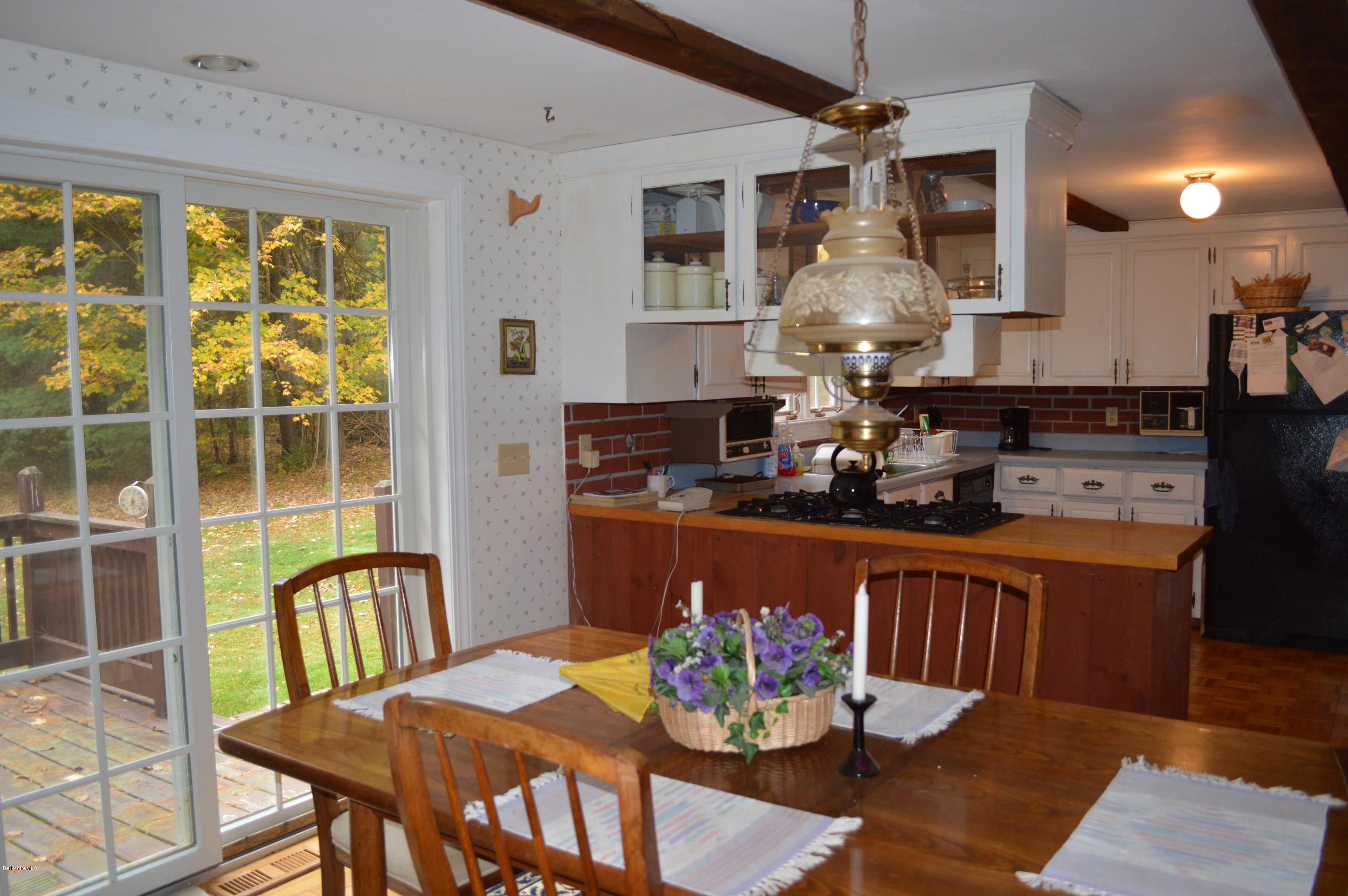 67 Main Road Tyringham, MA 01238 - Photo 7 of 20 a view of a dining room with furniture window and wooden floor