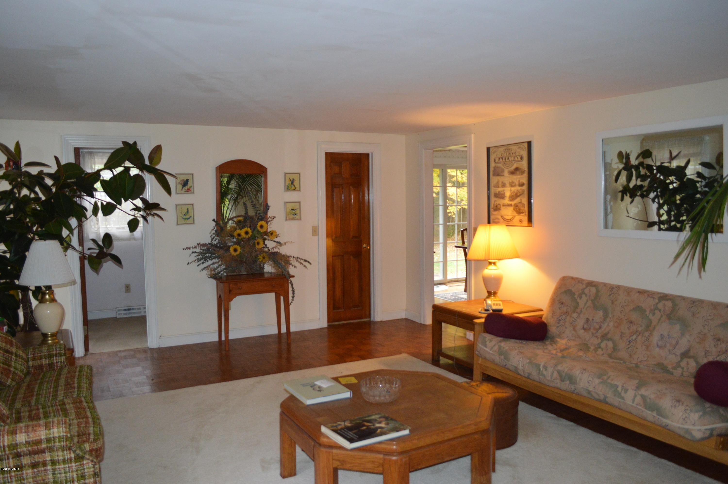 67 Main Road Tyringham, MA 01238 - Photo 10 of 20 a living room with furniture and wooden floor