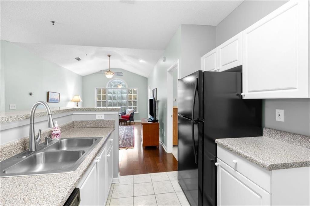 803 Spring Heights Lane Smyrna, GA 30080 - Photo 14 of 40 a kitchen with stainless steel appliances granite countertop a refrigerator and a sink