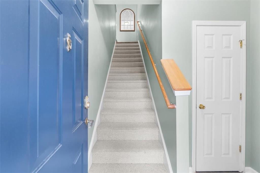 803 Spring Heights Lane Smyrna, GA 30080 - Photo 3 of 40 a view of a hallway with wooden floor and entryway