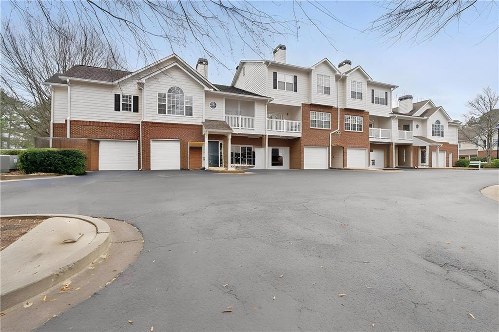 803 Spring Heights Lane Smyrna, GA 30080 - Photo 31 of 40 a view of a white building among the street with tall buildings