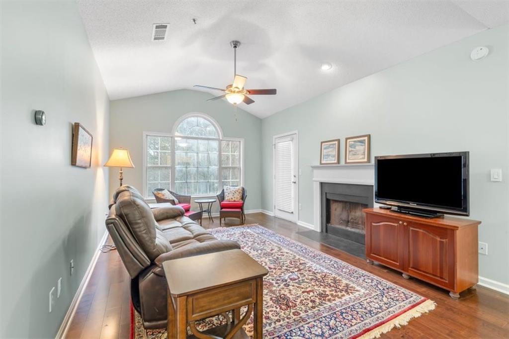 803 Spring Heights Lane Smyrna, GA 30080 - Photo 5 of 40 a living room with furniture and a flat screen tv