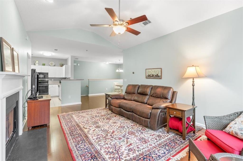 803 Spring Heights Lane Smyrna, GA 30080 - Photo 7 of 40 a living room with furniture and kitchen view