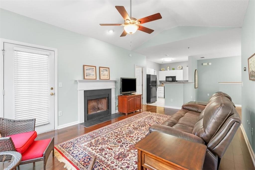 803 Spring Heights Lane Smyrna, GA 30080 - Photo 8 of 40 a living room with furniture and a fireplace