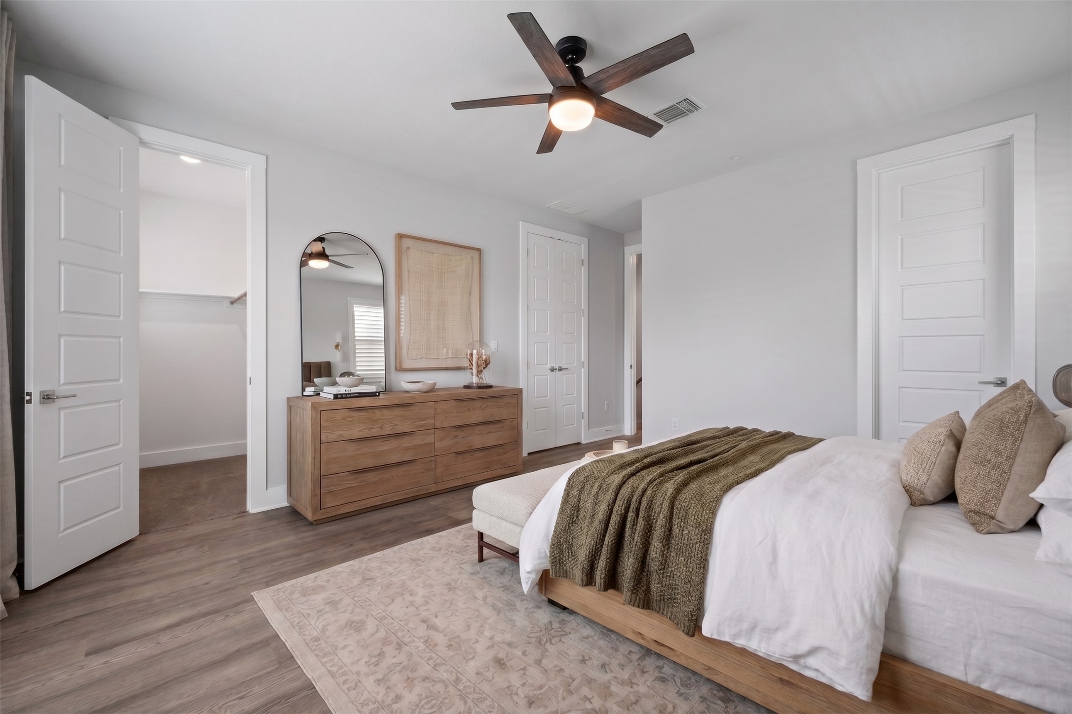 4515 Unity Circle Austin, TX 78731 - Photo 16 of 37 Smooth wood-look flooring and clean lines define this peaceful main-level bedroom retreat.