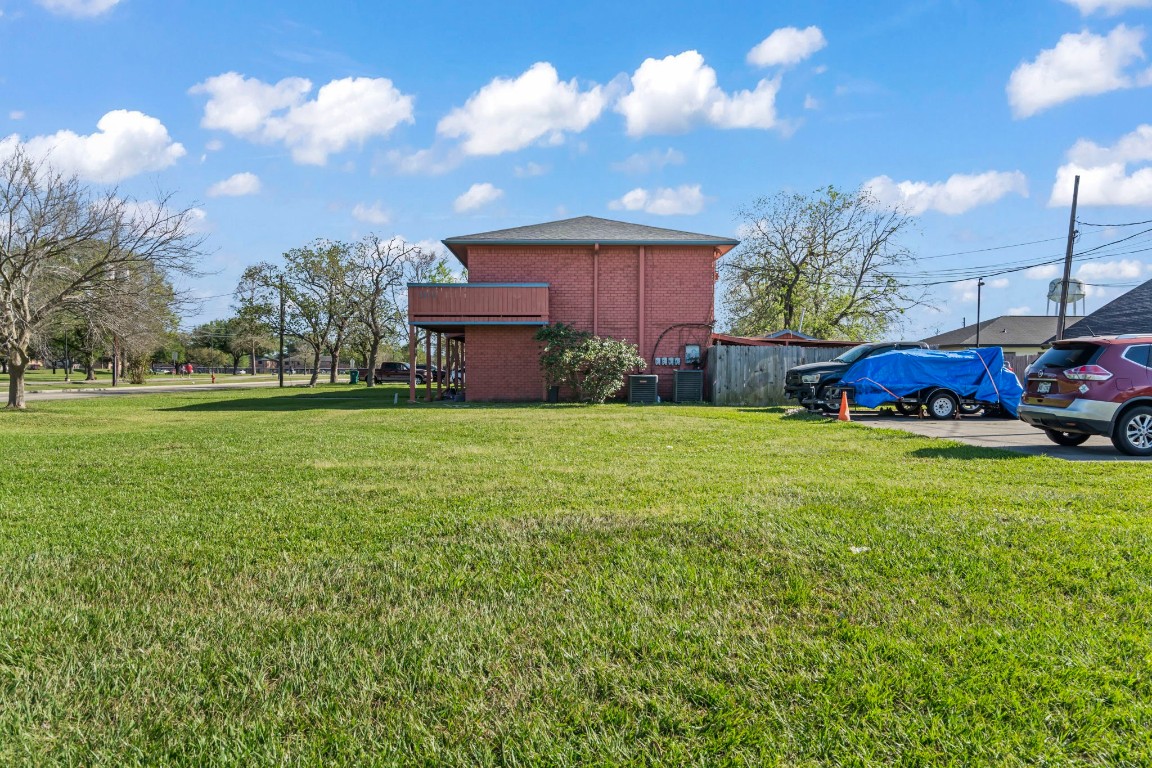 2816 Lafferty Road, Unit 4 Pasadena, TX 77502 - Photo 16 of 34 a view of a house with a yard