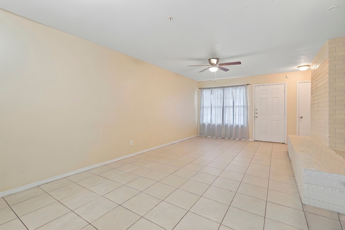 2816 Lafferty Road, Unit 4 Pasadena, TX 77502 - Photo 10 of 34 wooden floor in an empty room with a window