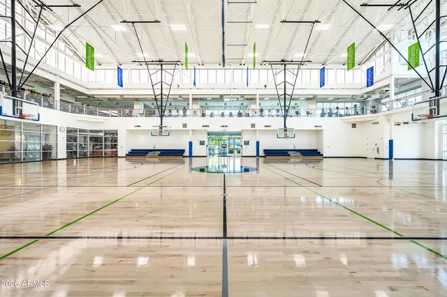 a backyard of a house with lots of trees and wooden fence