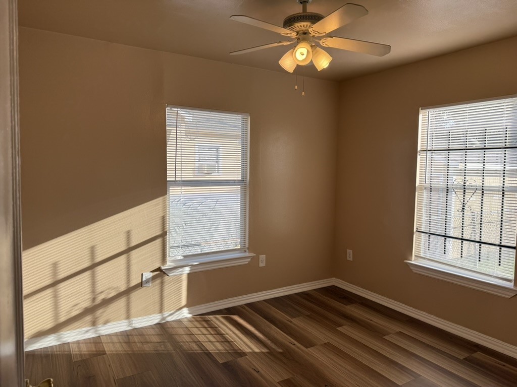 3402 Seabrook Street Houston, TX 77021 - Photo 9 of 18 a view of an empty room with window and chandelier fan