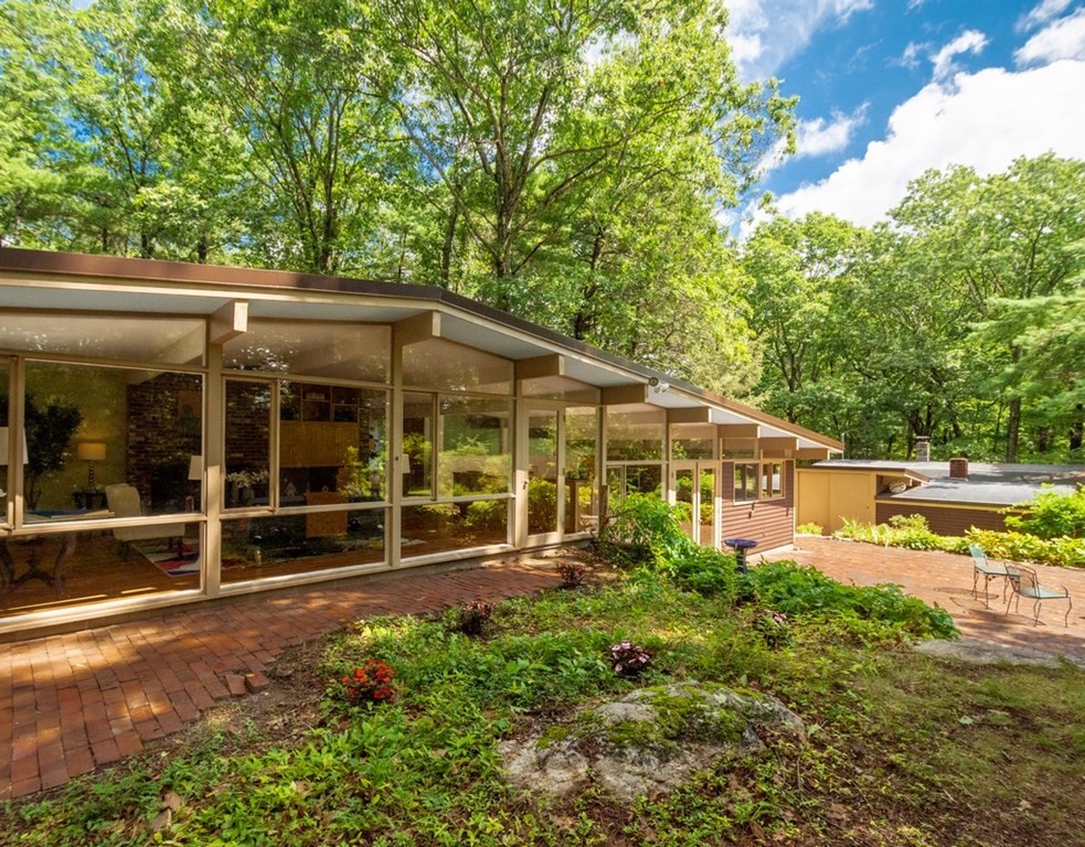 64 Baker Bridge Road Lincoln, MA 01773 - Photo 1 of 34 a view of a house with pool and garden