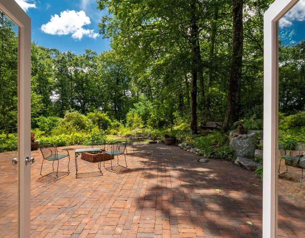 64 Baker Bridge Road Lincoln, MA 01773 - Photo 13 of 34 a view of a chairs in a backyard